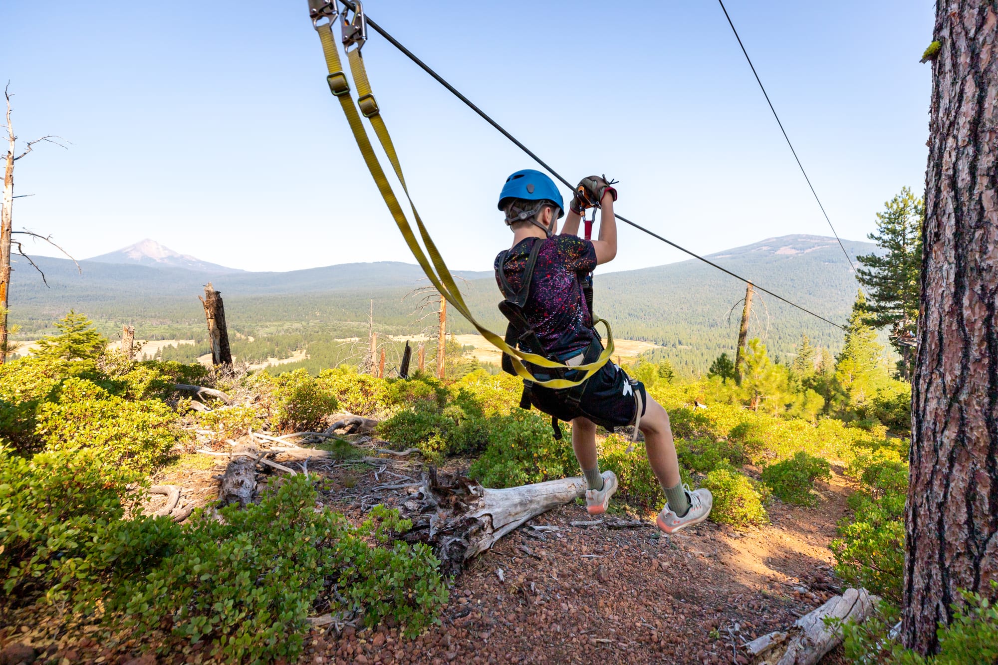 Kid trying ziplining at Crater Lake Zip Line