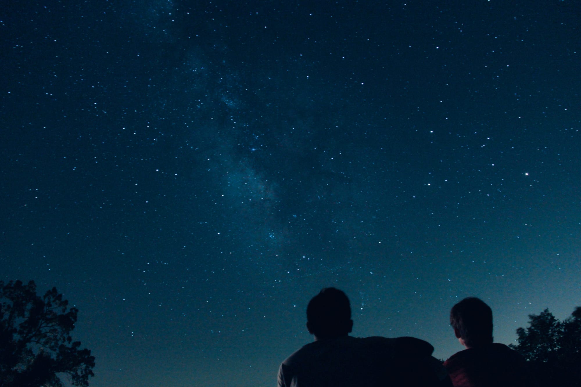 Two people gazing up at the stars
