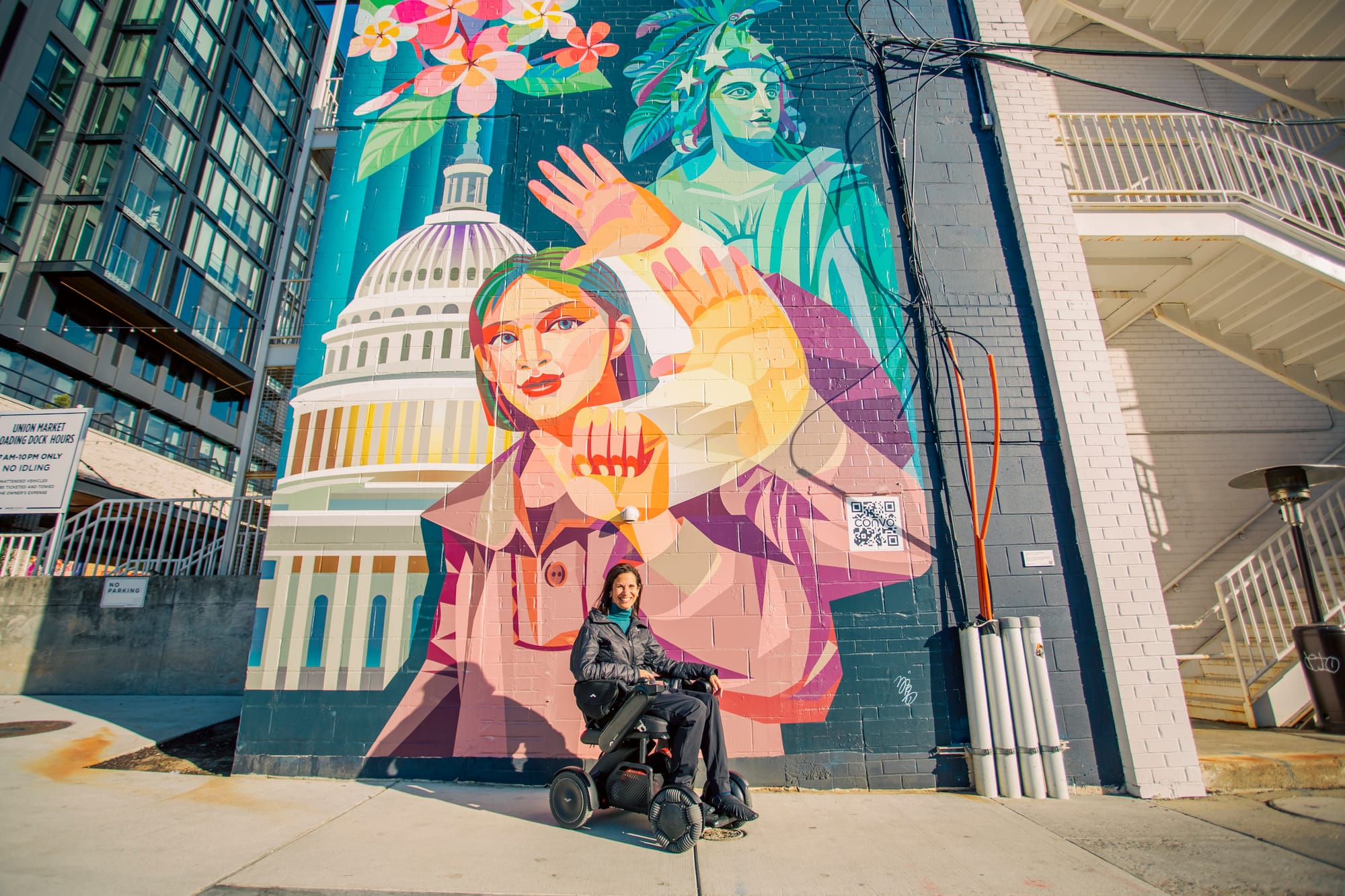 Sylvia Longmire in front of a Washington DC mural