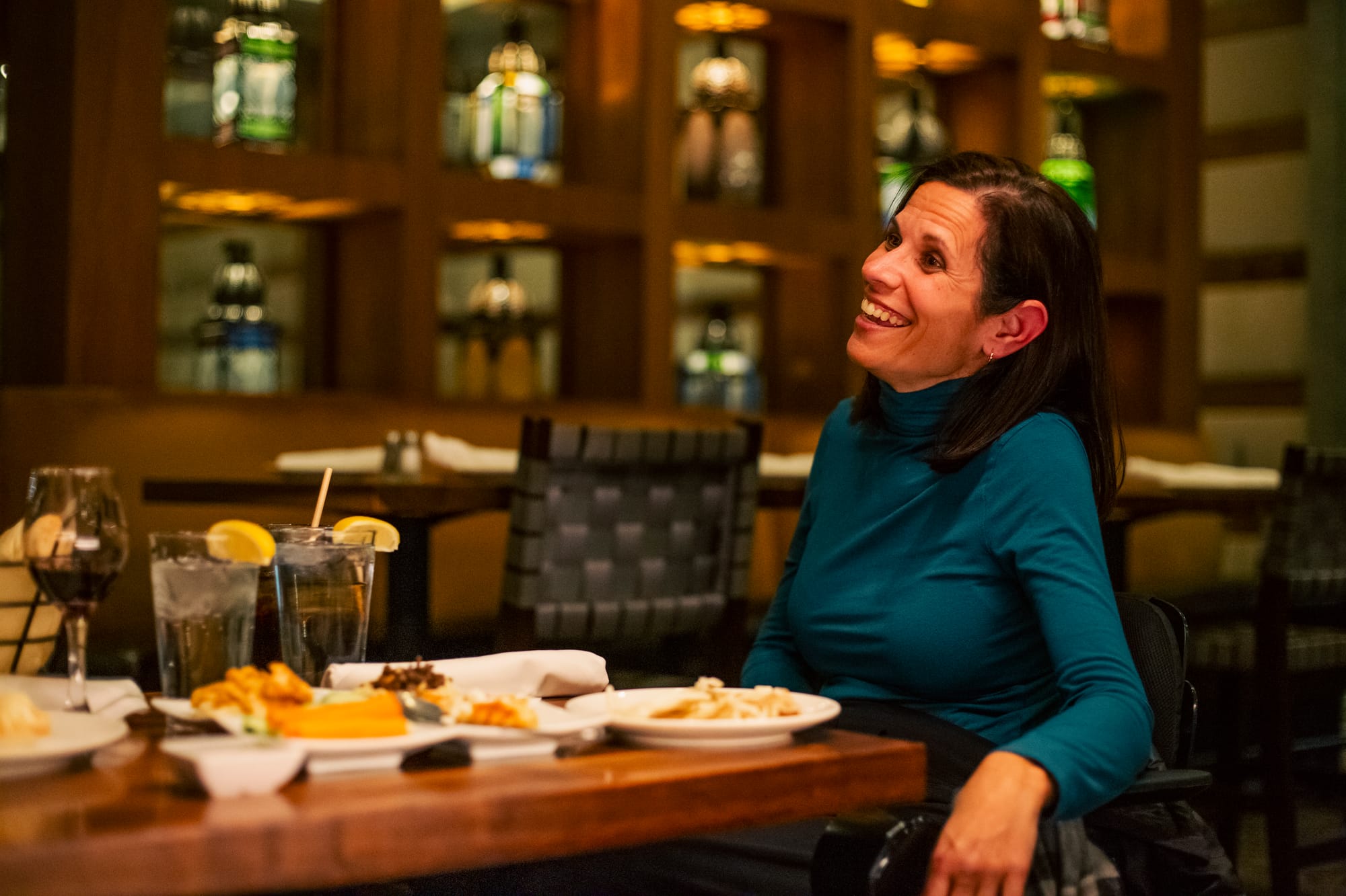 Sylvia Longmire, wheelchair user, enjoying dinner in Washington DC