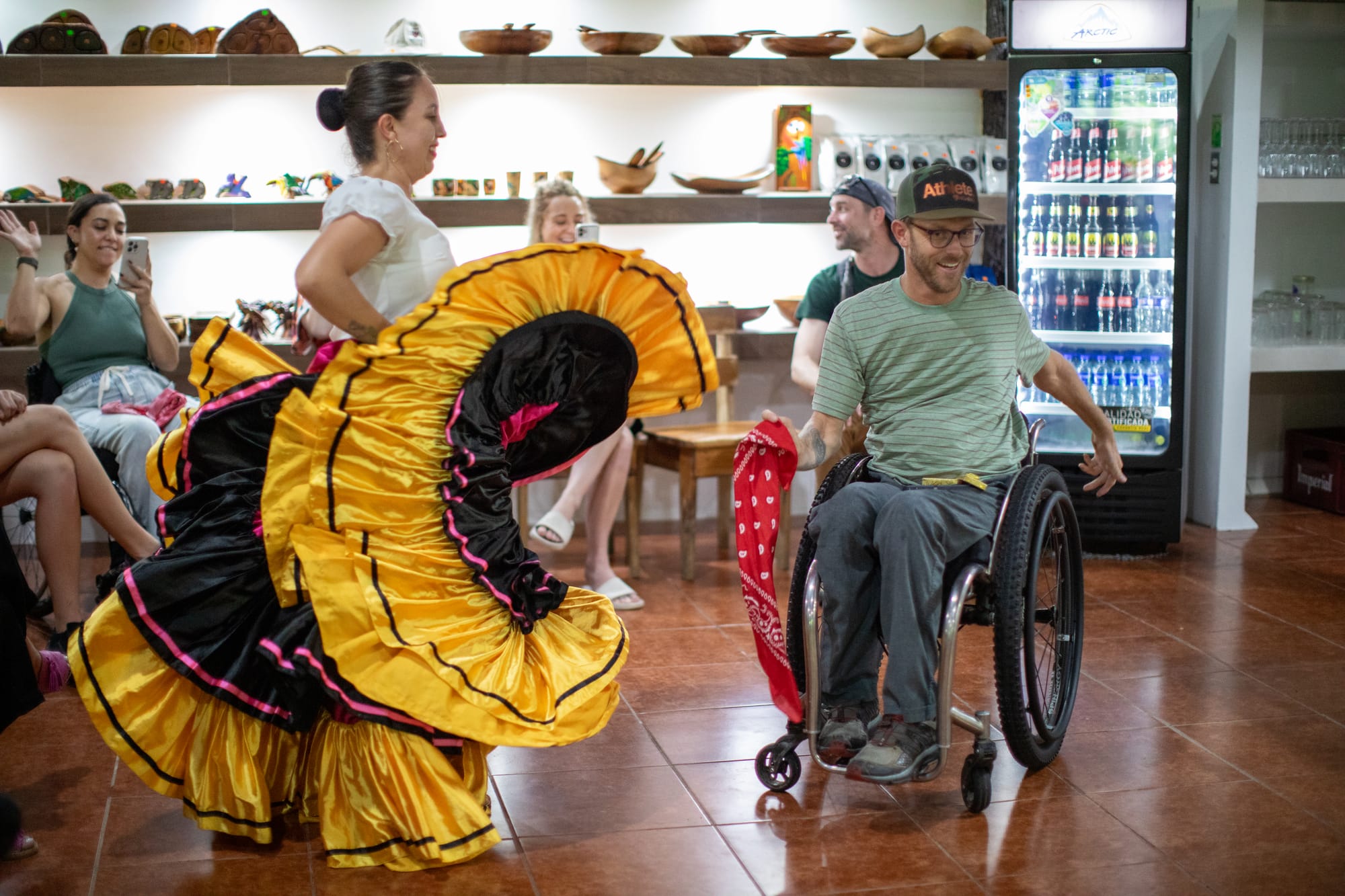 Wheelchair user dancing with locals in Costa Rica