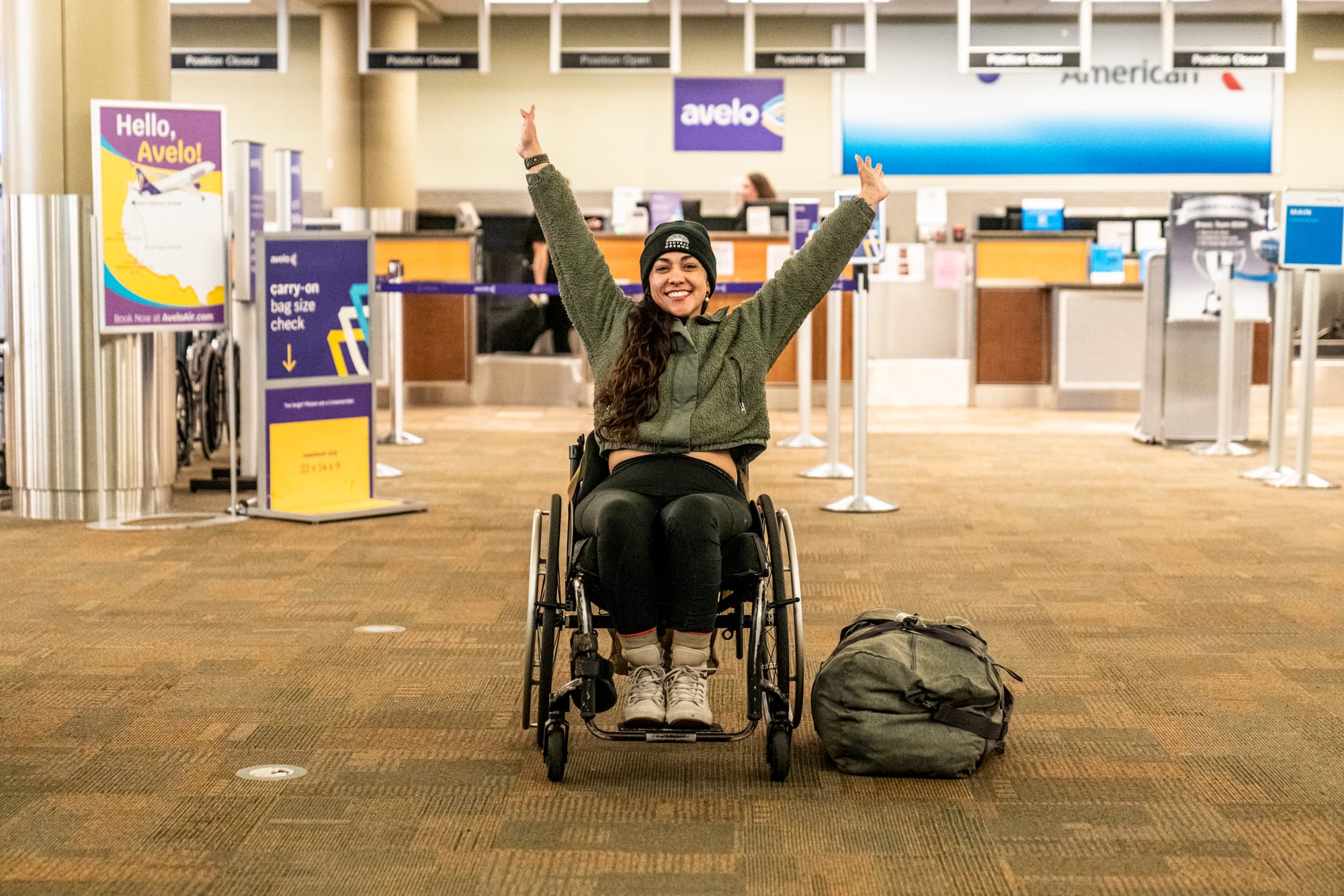 Wheelchair user smiling and happy at the airport