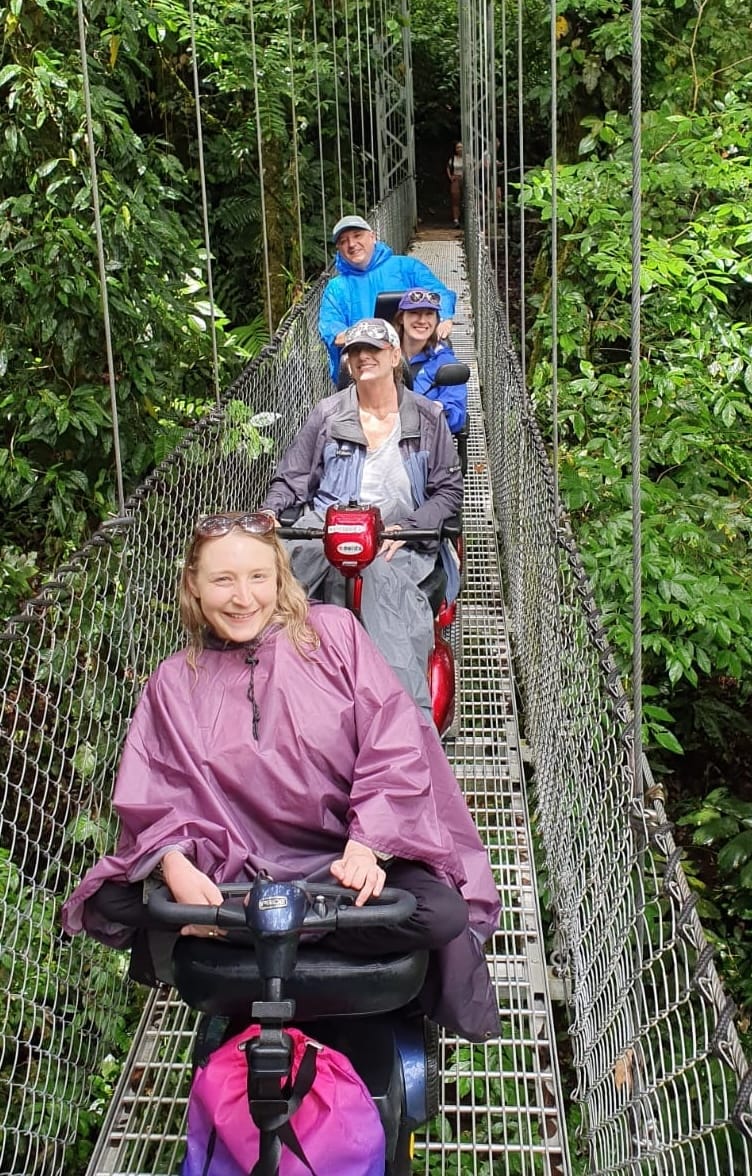 Wheelchair users on an accessible bridge in Costa Rica