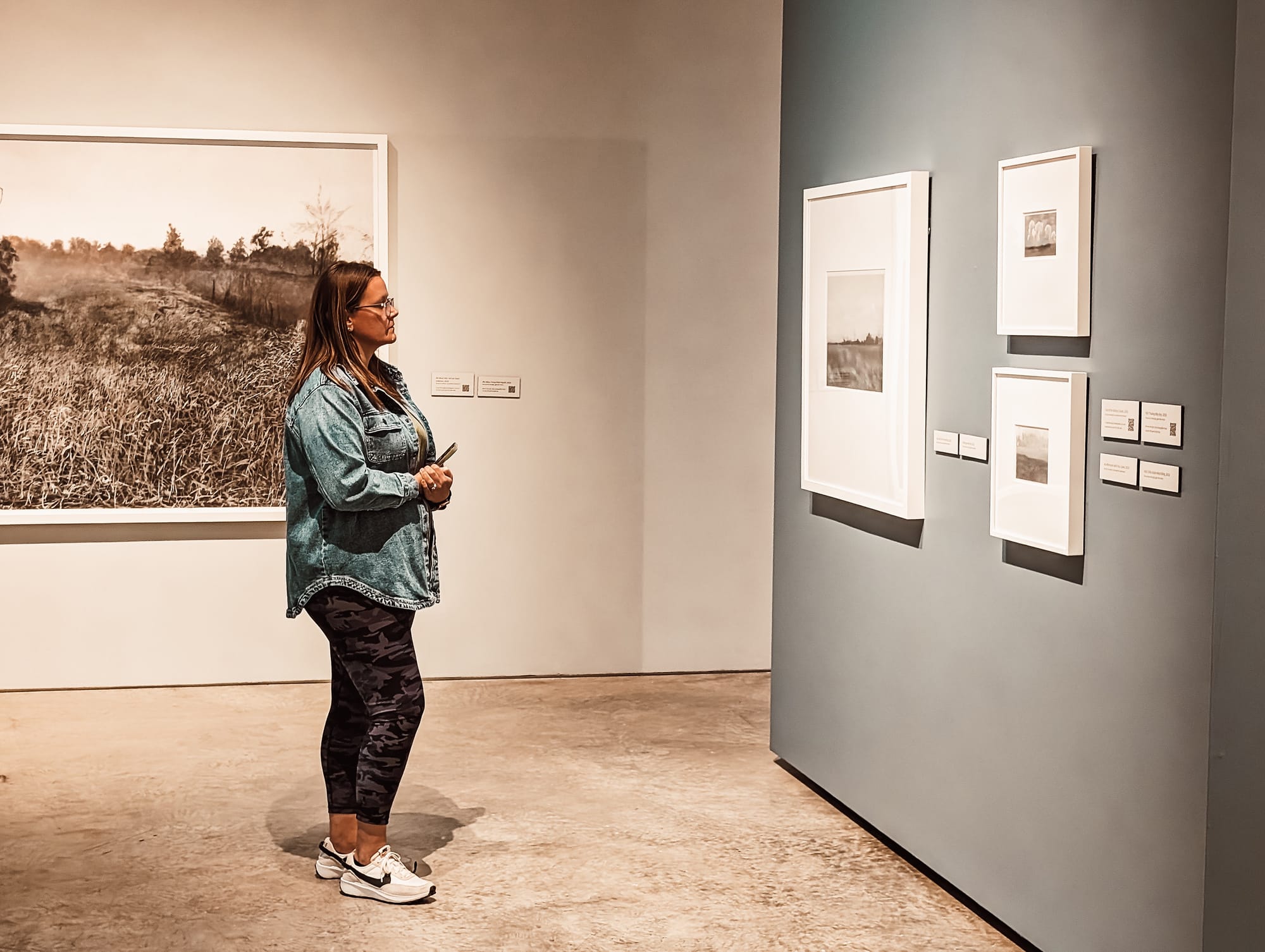 Lady looking at art at Sioux City Art Center