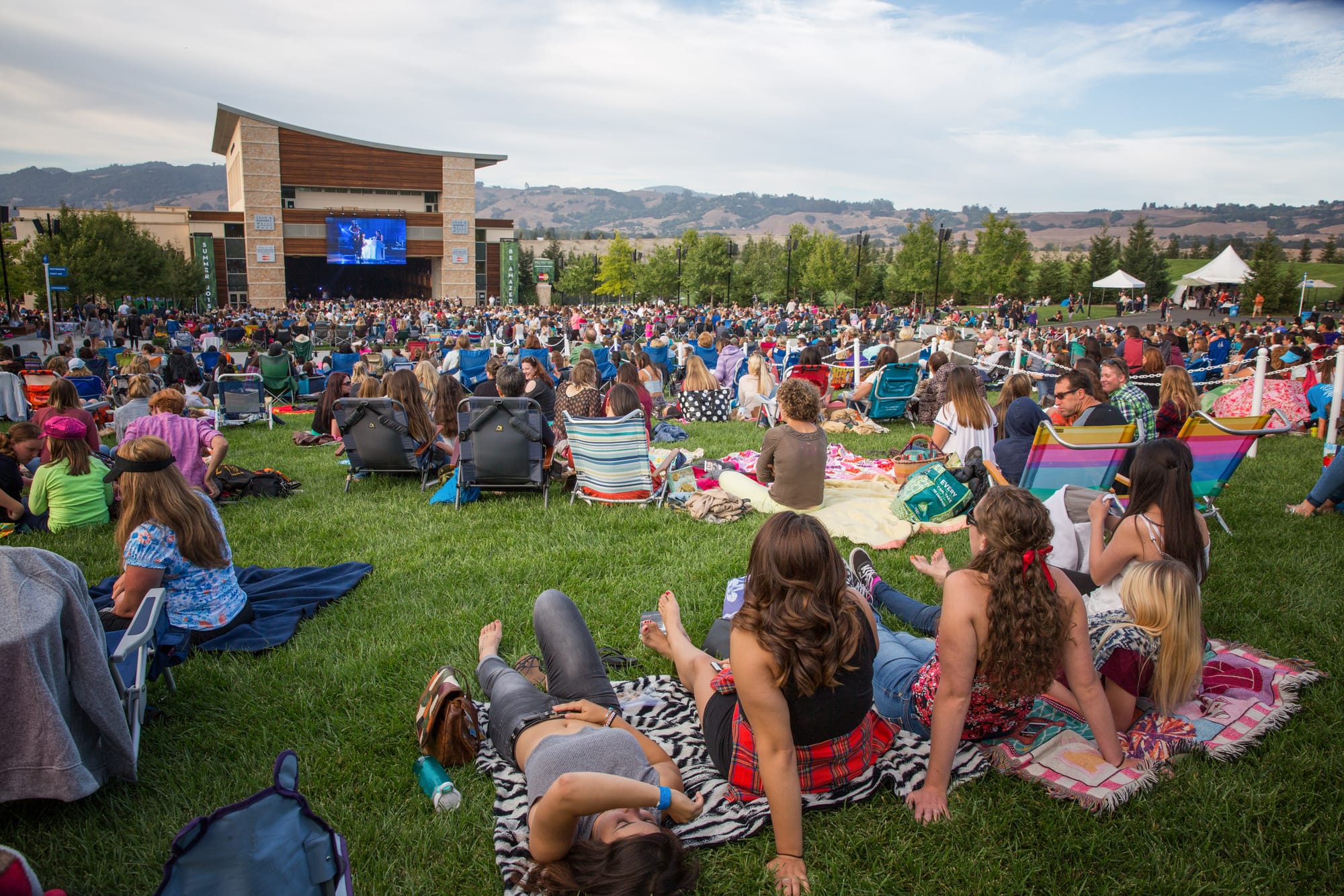 People gathering on the lawn at a music event in Sonoma County, CA
