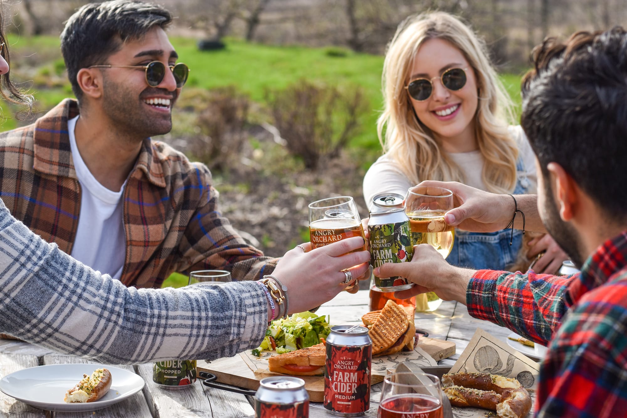 Friends enjoying cider and food at Angry Orchard in Orange County, NY