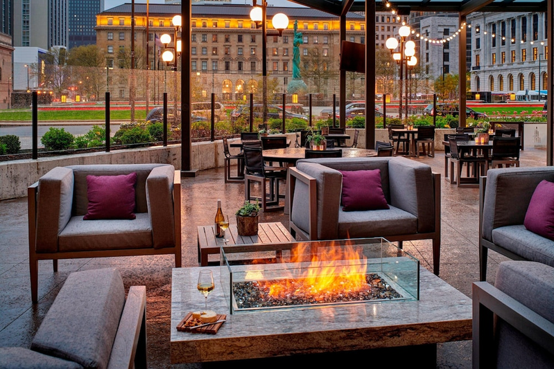 Outdoor patio with chairs and fire at Cleveland Marriott Downtown at Key Tower