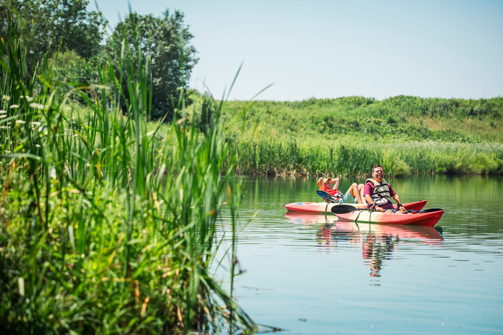 Wheelchair user kayaking on VOA Lake in Butler County