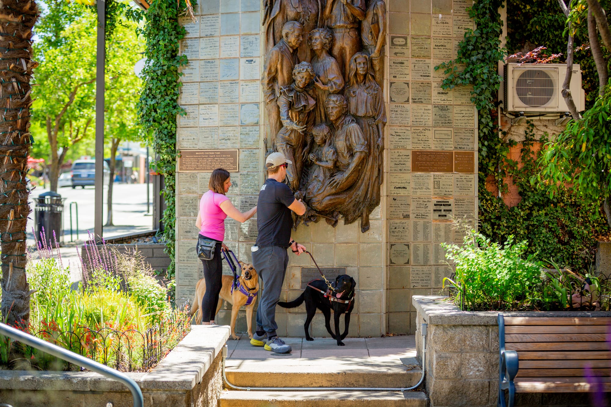 Blind couple checking out a sculpture in Ashland, Oregon