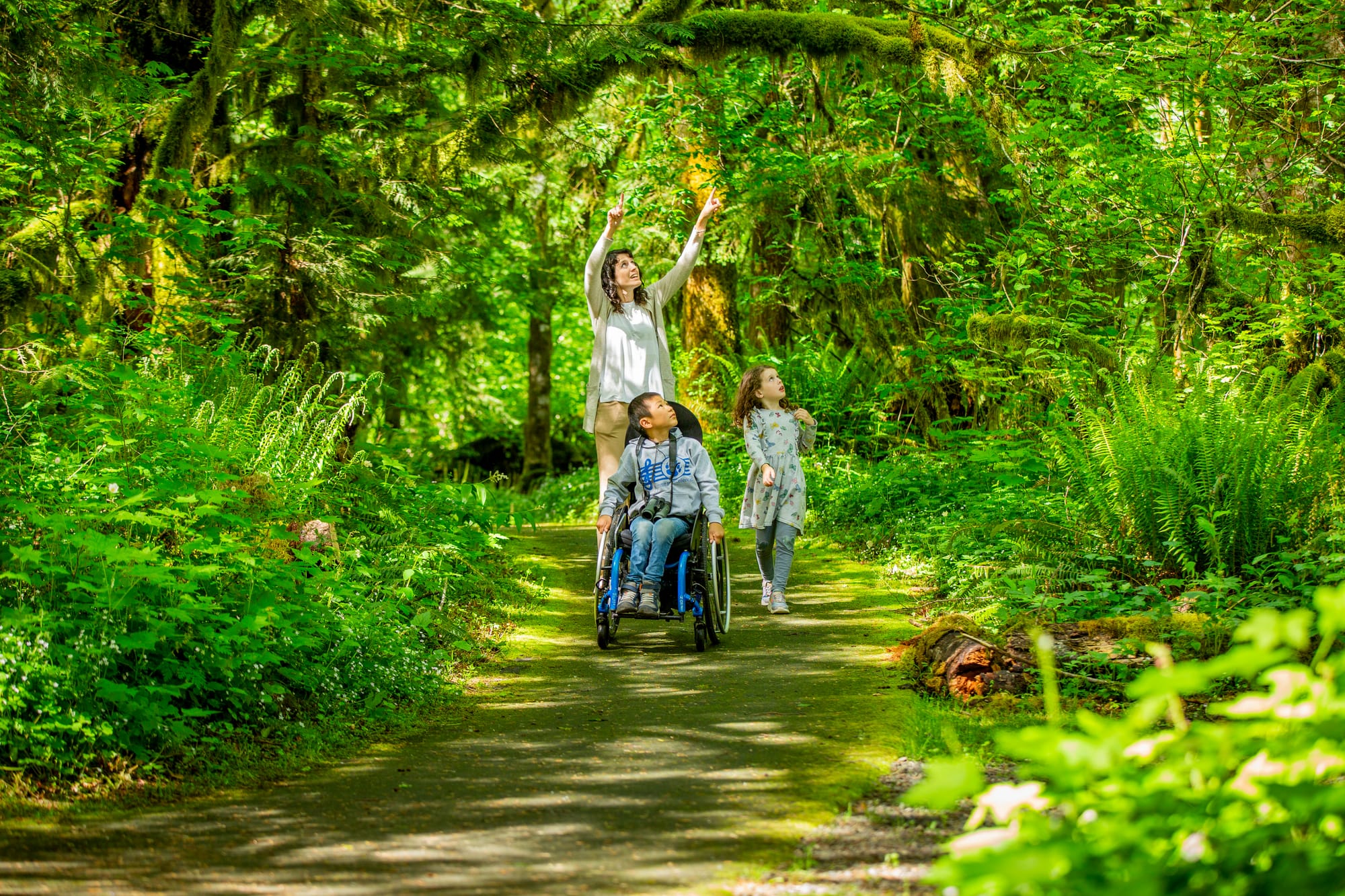 Family exploring accessible trails on Cascade Streamwatch Trail