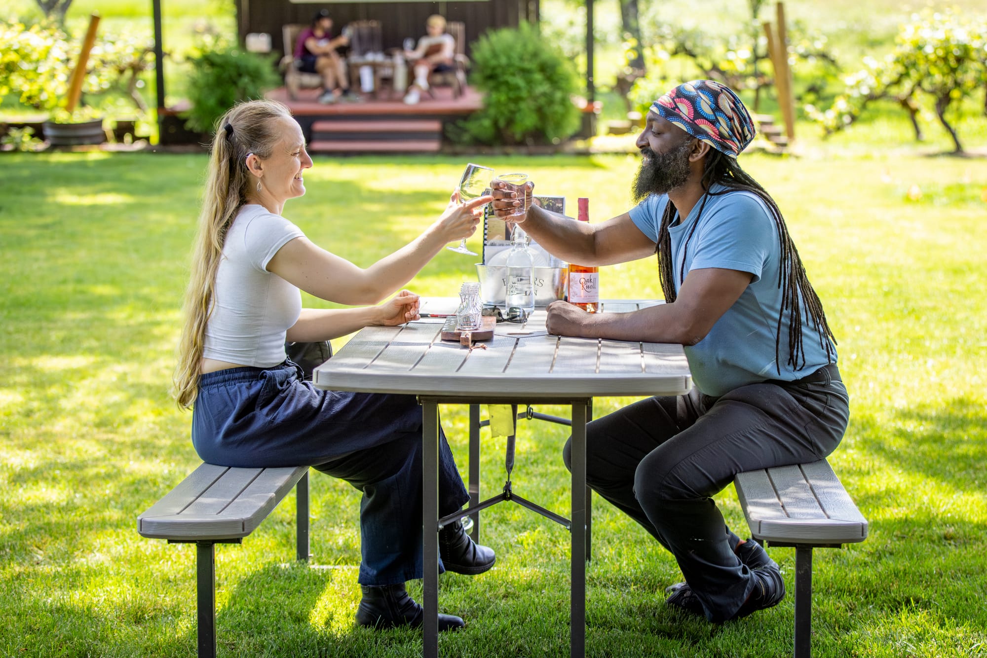 Friends cheering wine glasses