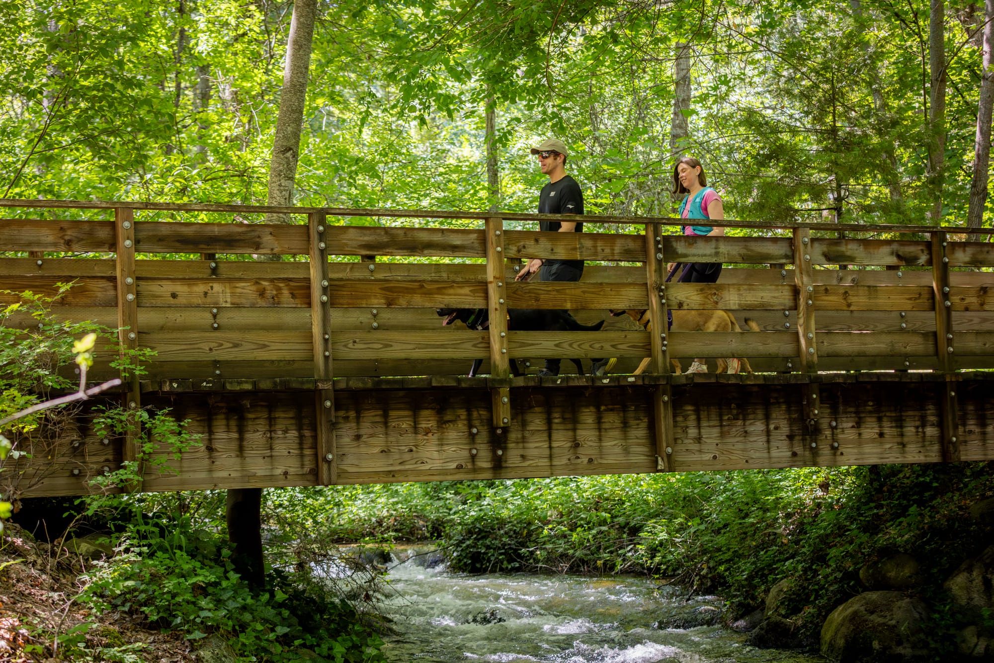 Blind couple crossing a bridge on Lithia Park trails, Ashland