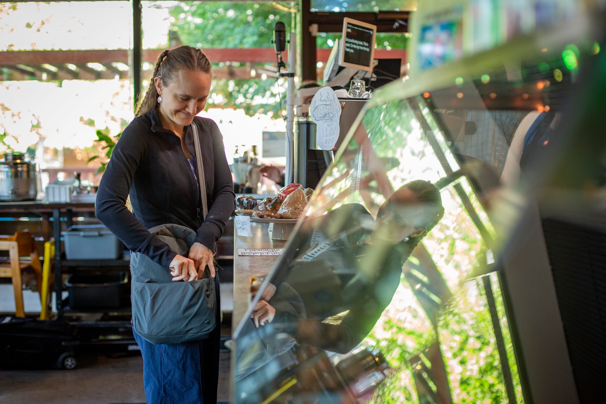 Deaf lady ordering at Woodstock Cafe - a local Deaf-Operated Cafe in Portland, Oregon