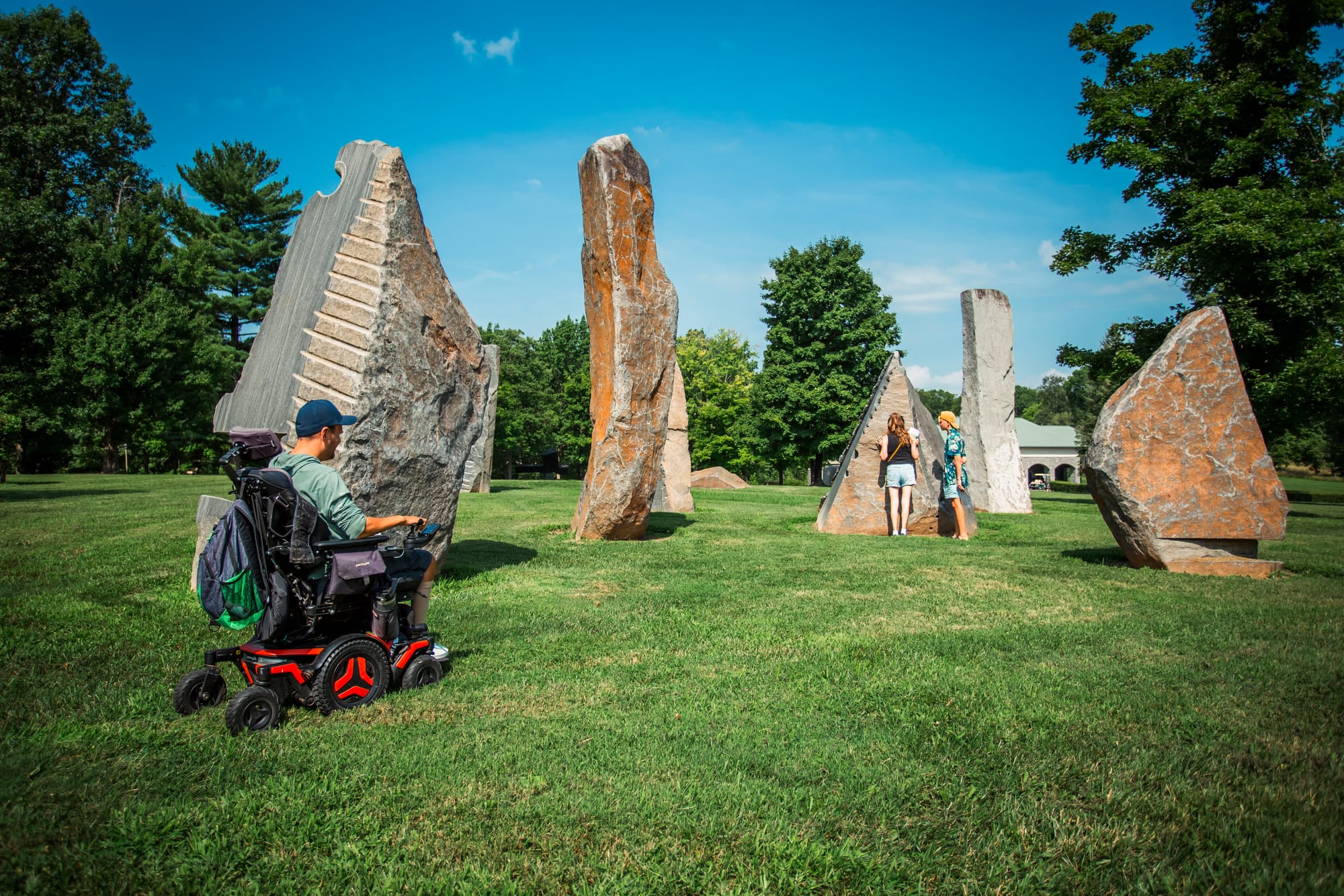 Wheelchair user and family exploring Pyramid Sculpture Park in Butler County