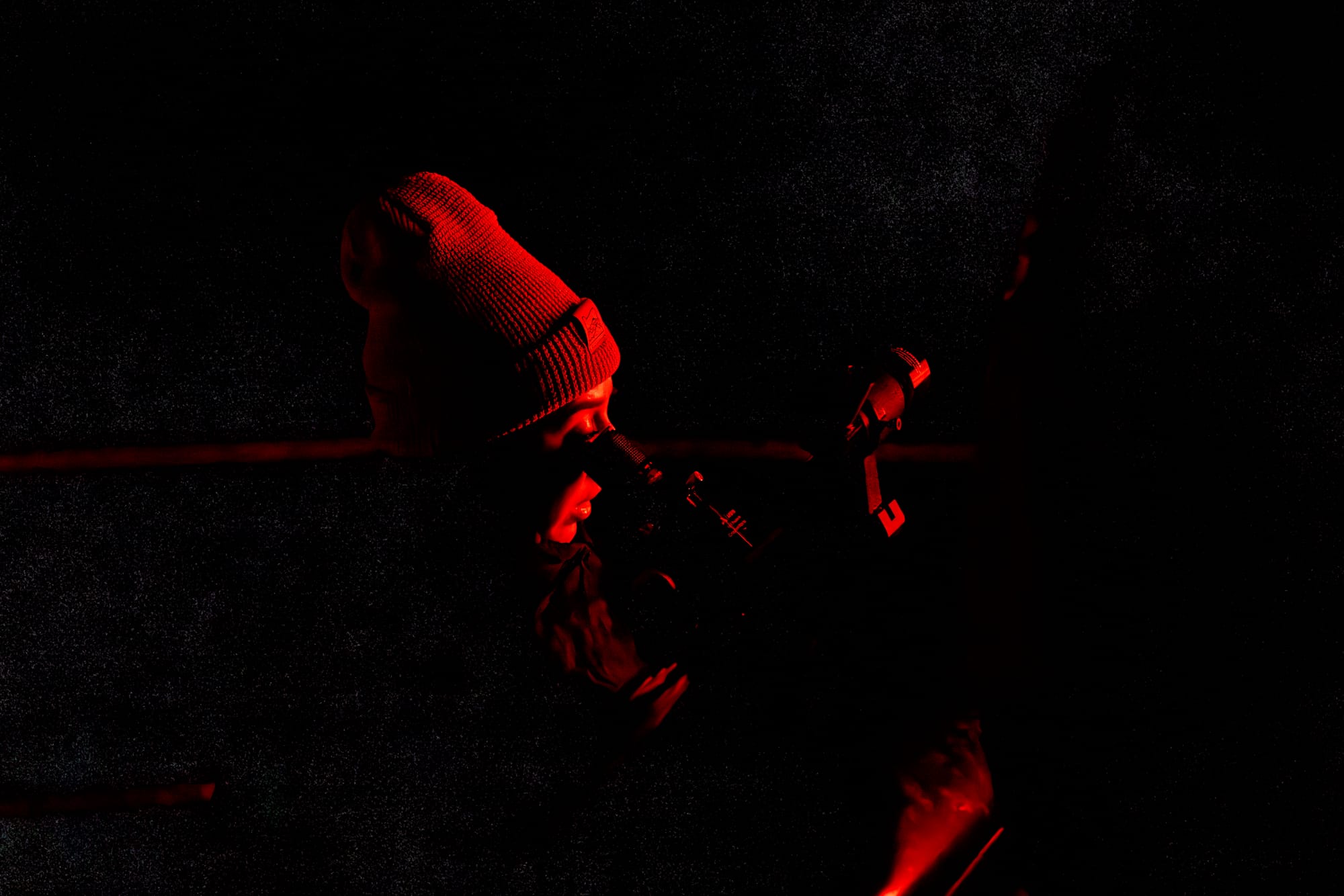 Kaylee looking through the telescope at Prineville Reservoir at night