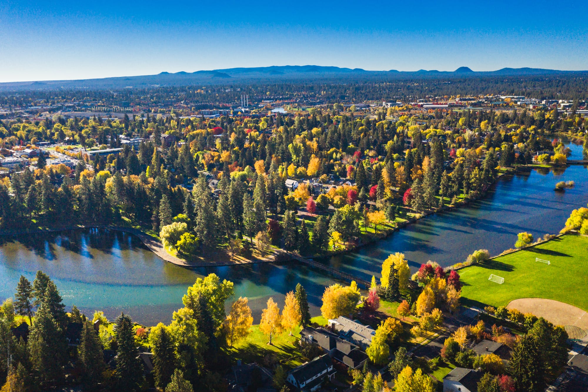 Aerial view of Bend, Oregon with fall color trees and Deschutes River