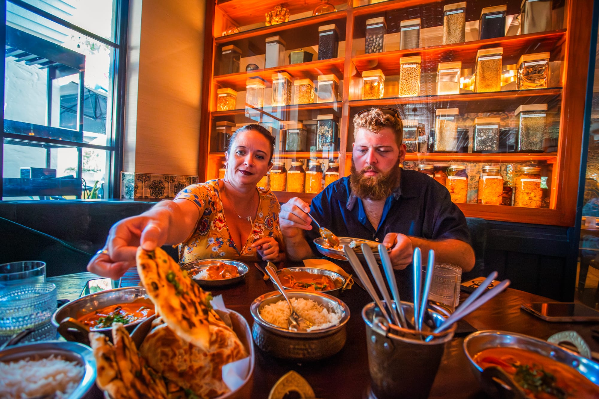 Deaf travelers enjoying food at Ela Curry & Cocktails in Palm Beaches