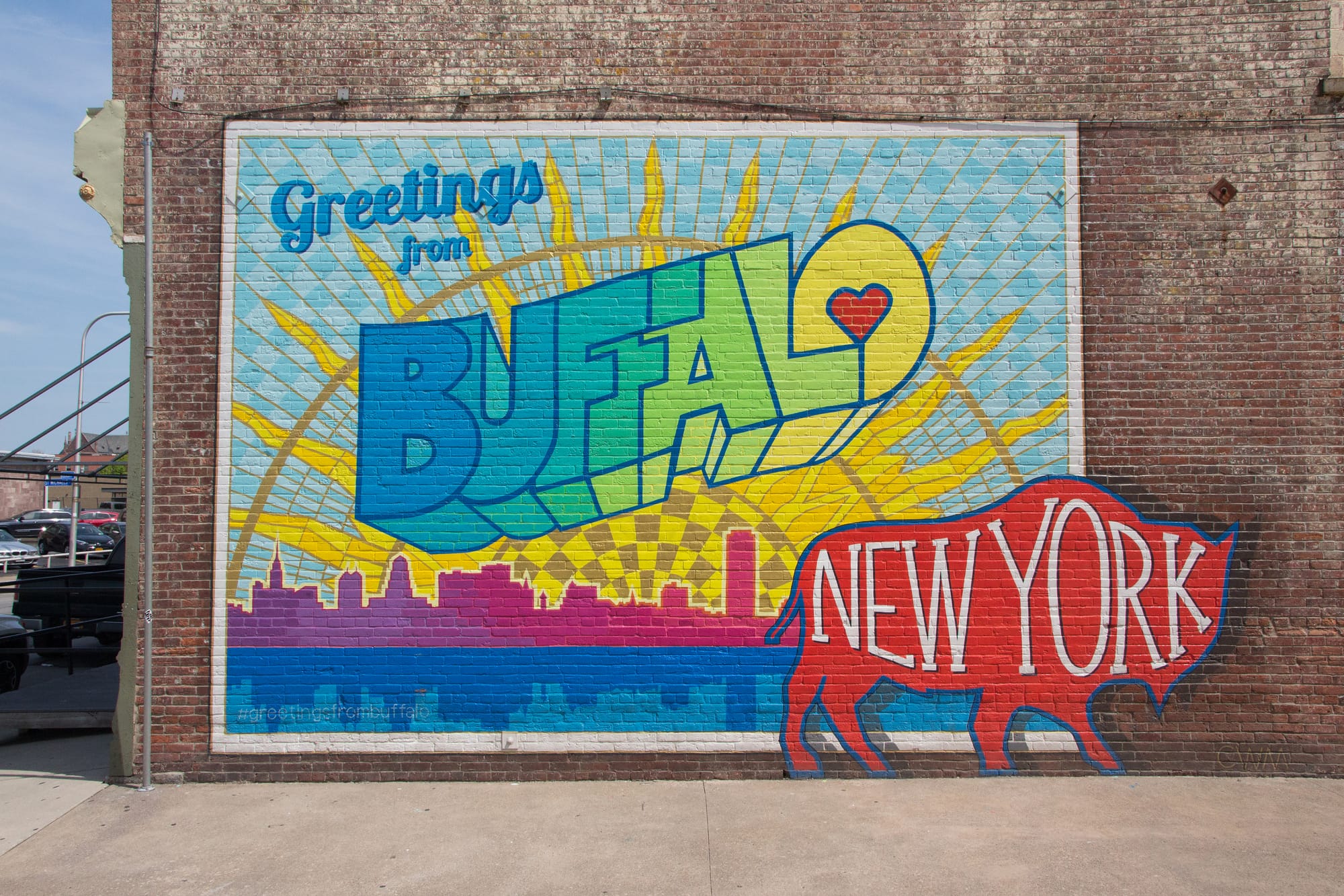 Colorful mural in Buffalo, NY that reads "Greetings from Buffalo, New York"
