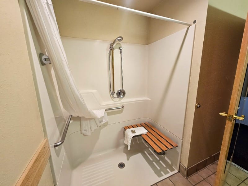 Roll-in shower and seat at Country Inn & Suites by Radisson
