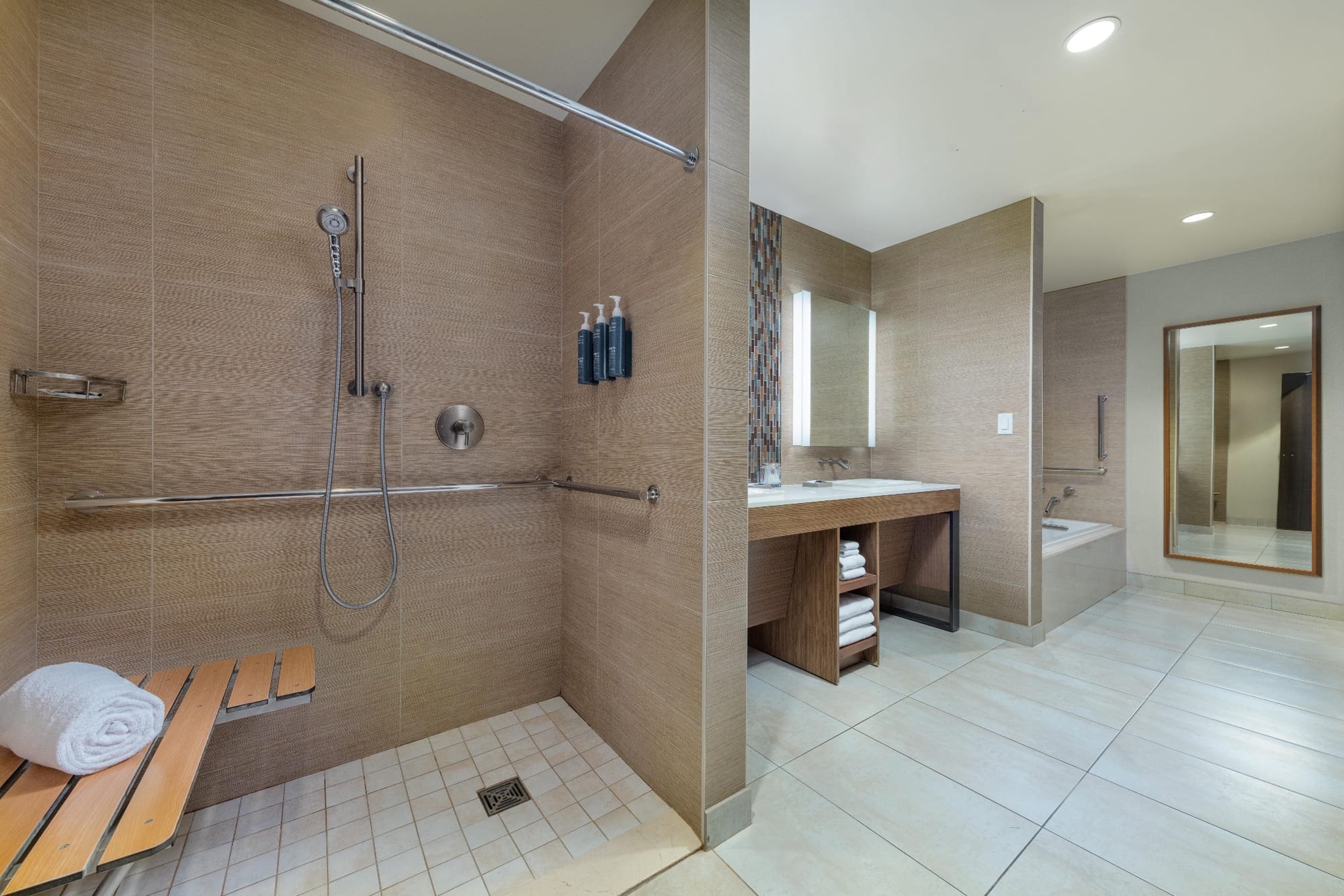 Roll-in shower with seat and grab bars at The Westin Buffalo