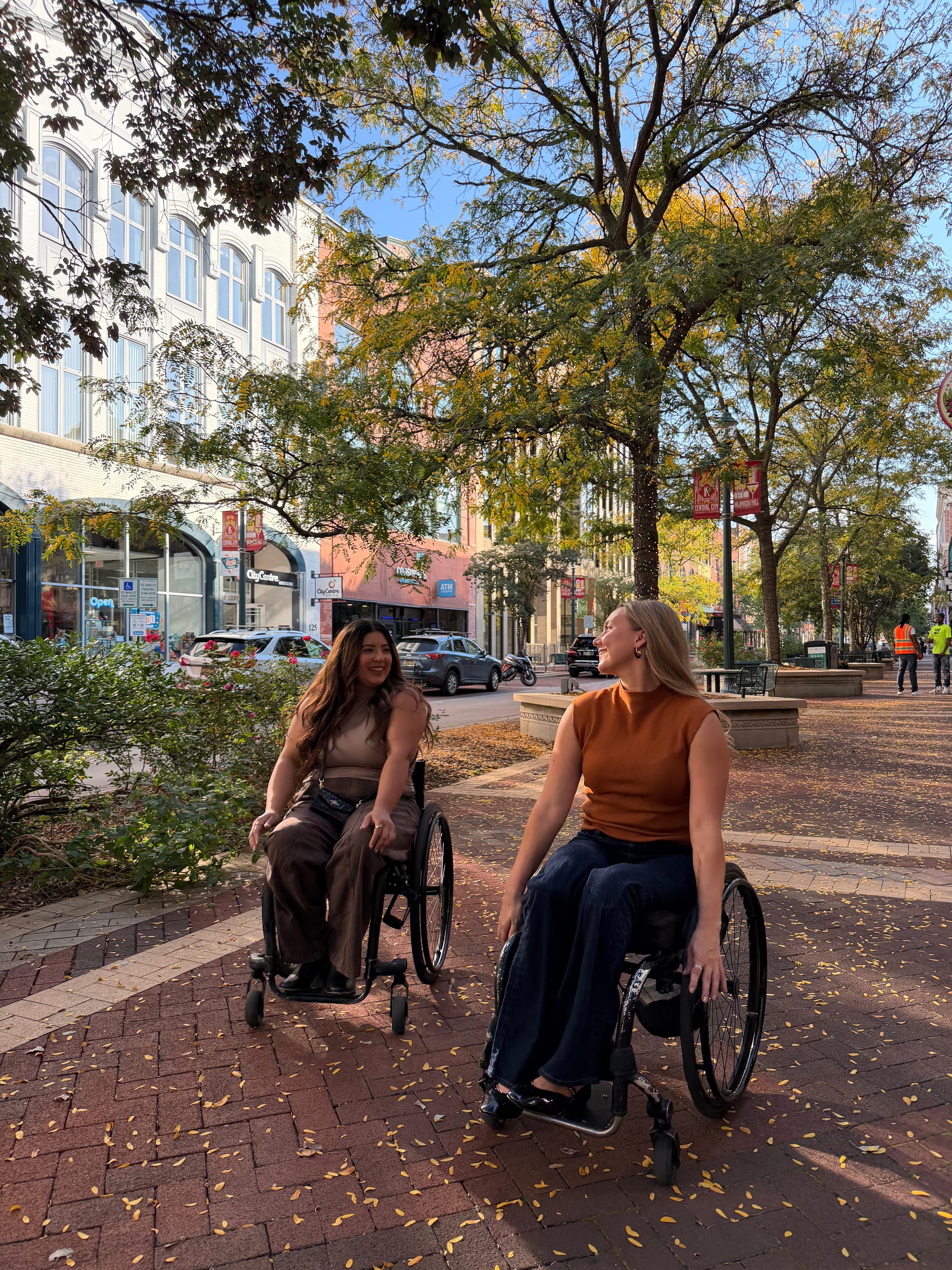 Two wheelchair users exploring downtown Kalamazoo