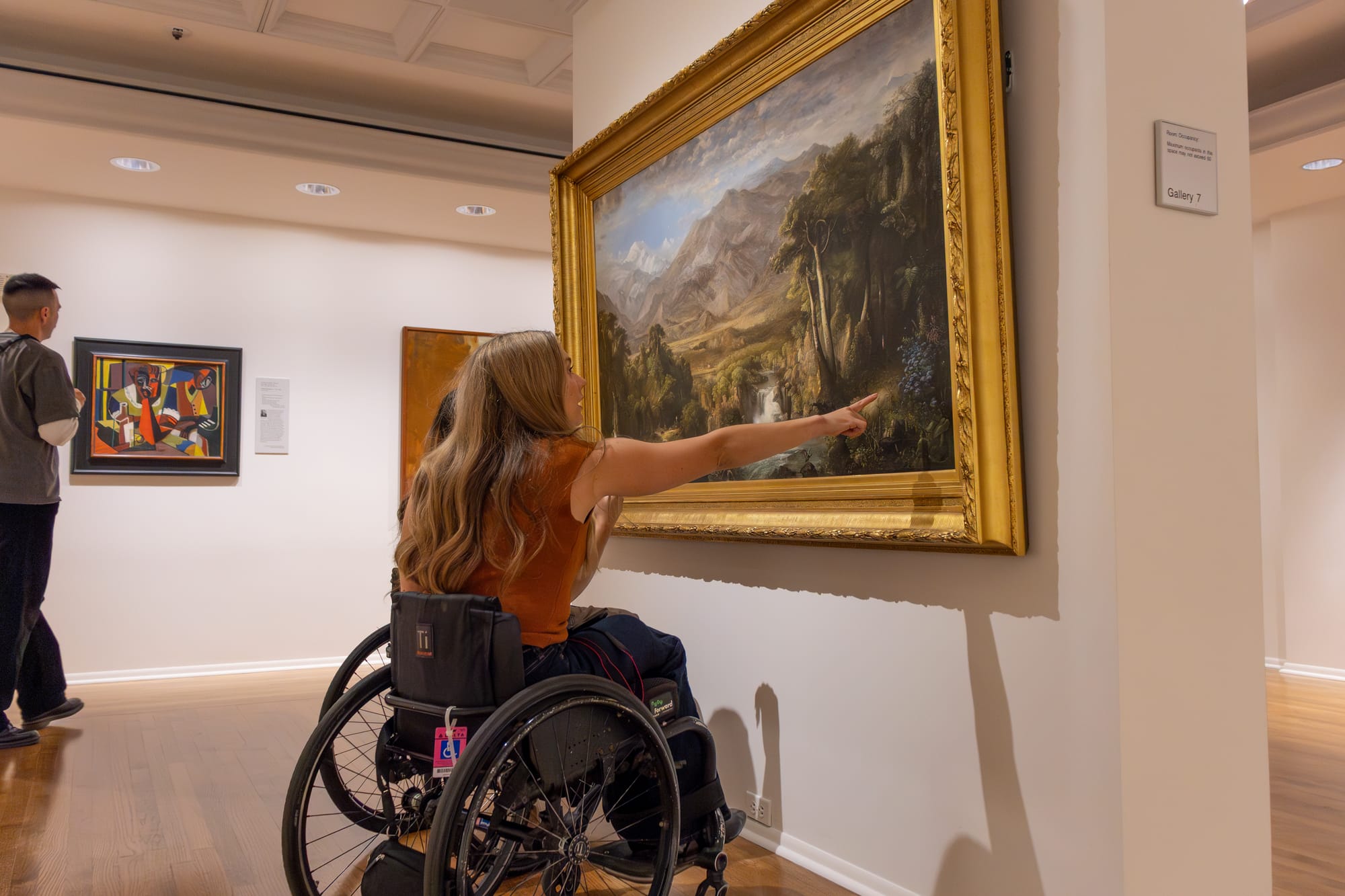 Wheelchair user viewing art at Kalamazoo Institute of Arts