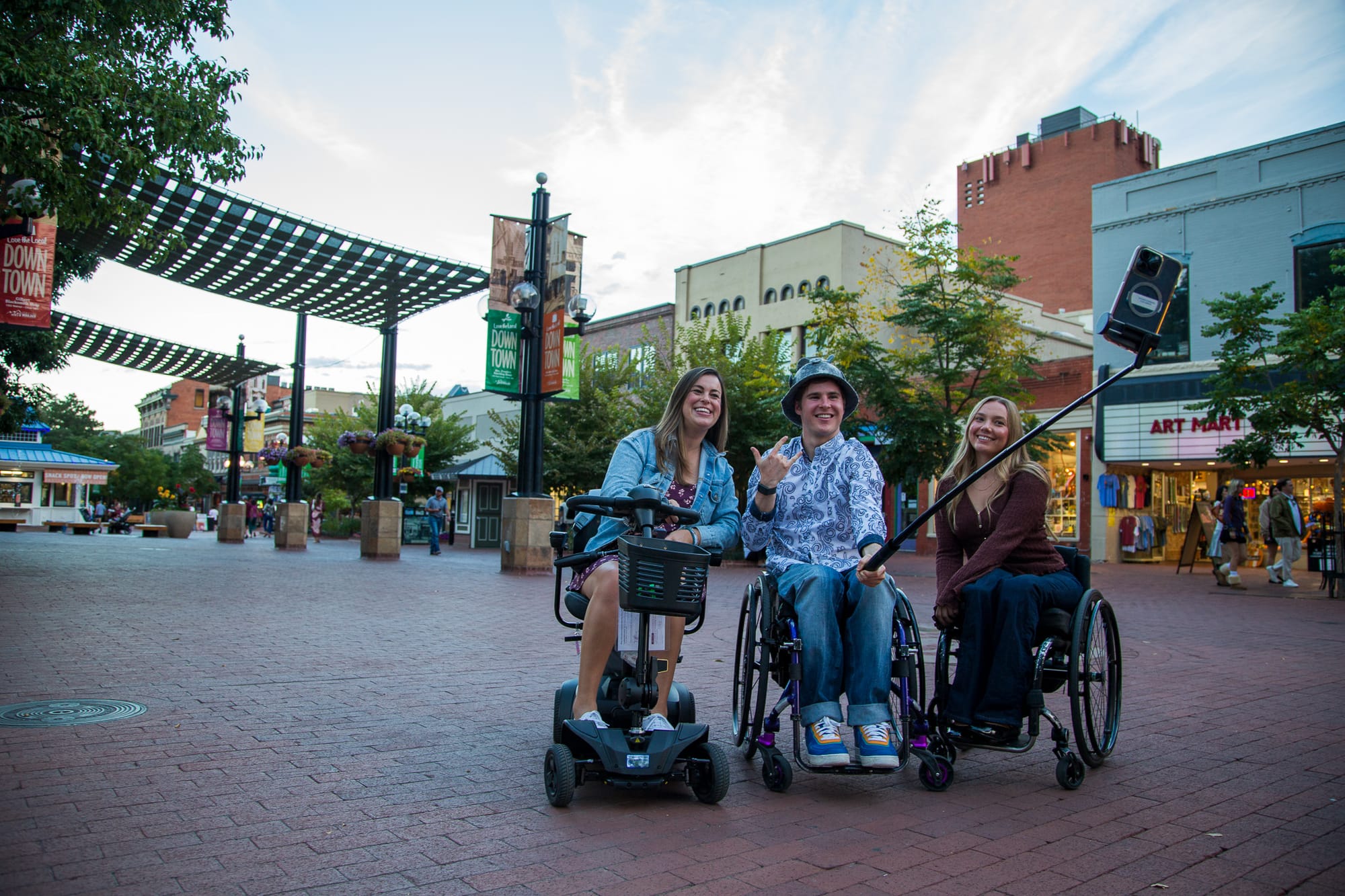 Three wheelchair users taking a selfie in Boulder, Colorado