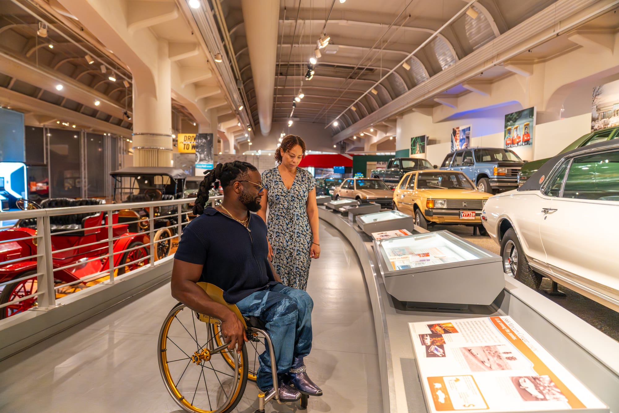 Matt Scott, wheelchair user, on a guided tour at Henry Ford Museum