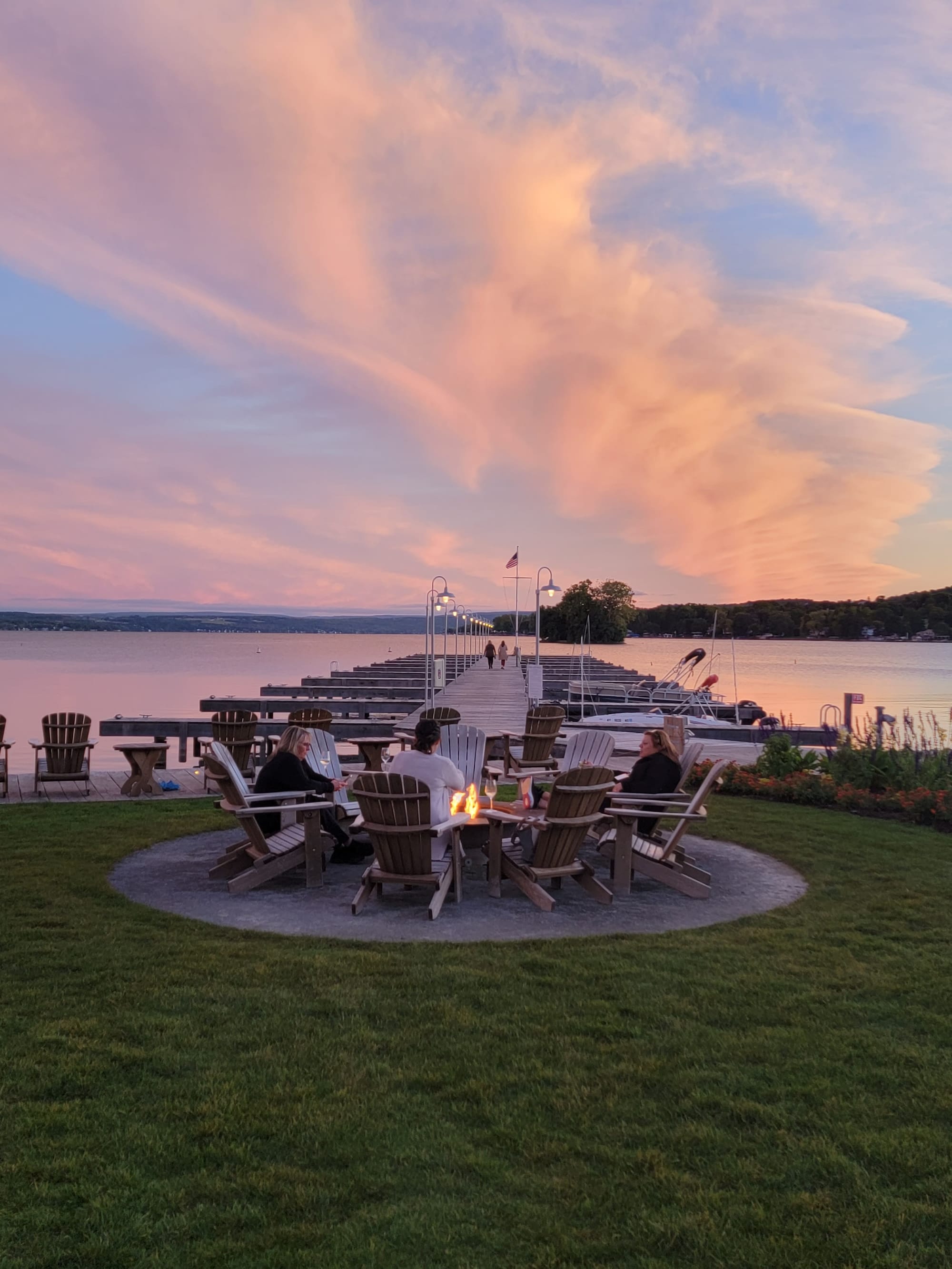 People enjoying the fire pit at The Lake House hotel, NY