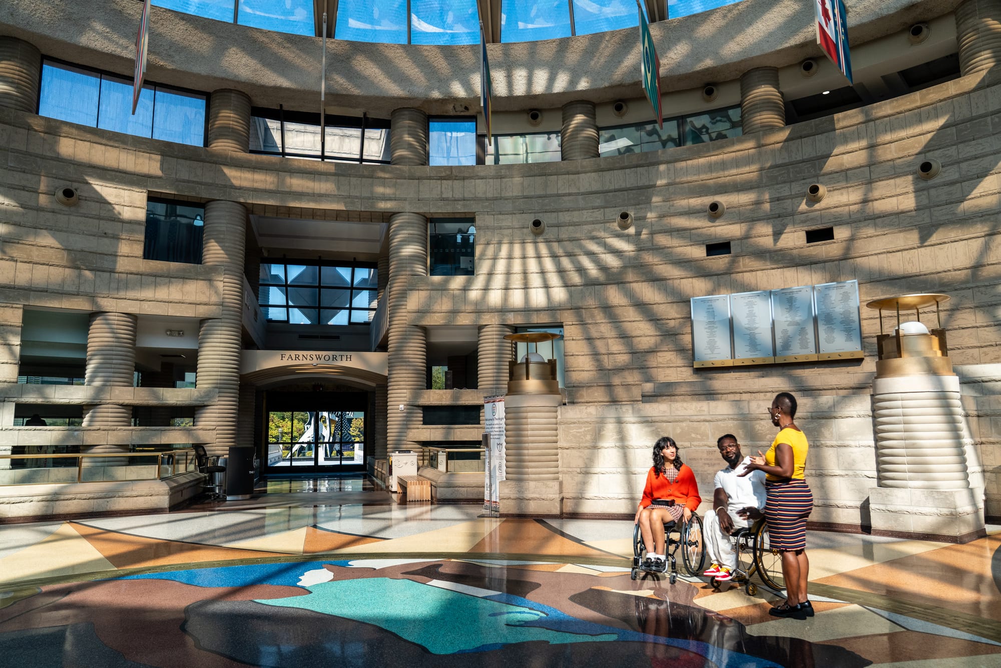 Matt and Kaylee, wheelchair users, at Charles H. Wright Museum of African American History