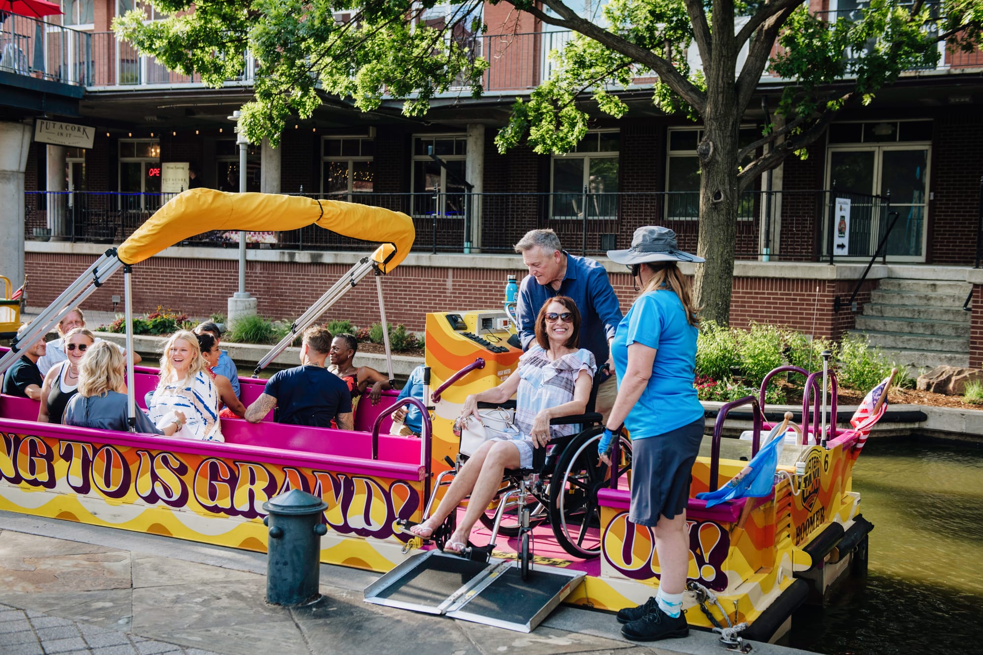 Wheelchair user entering the Bricktown Water Taxi in Oklahoma City