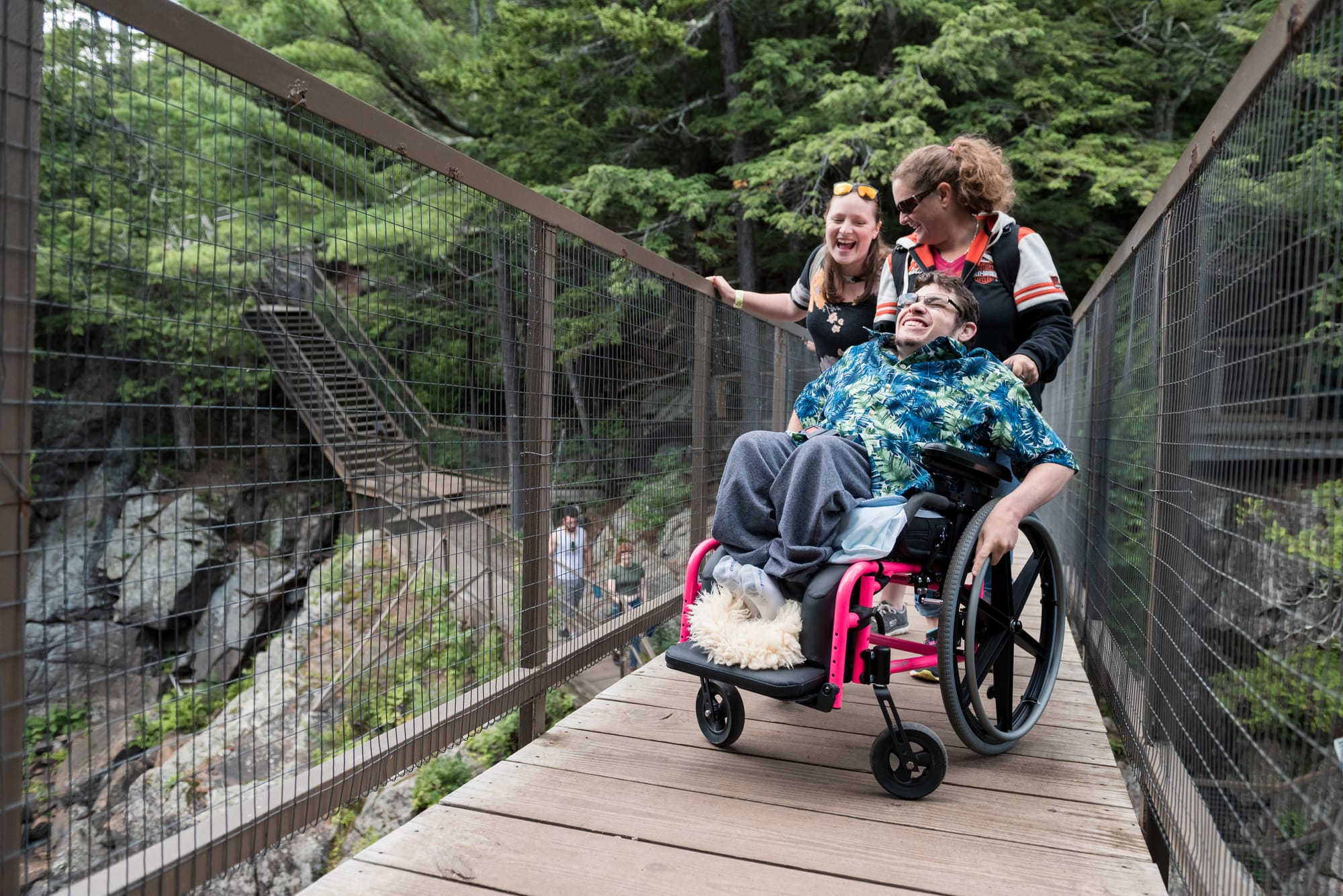 Wheelchair user crossing bridge at High Falls Gorge