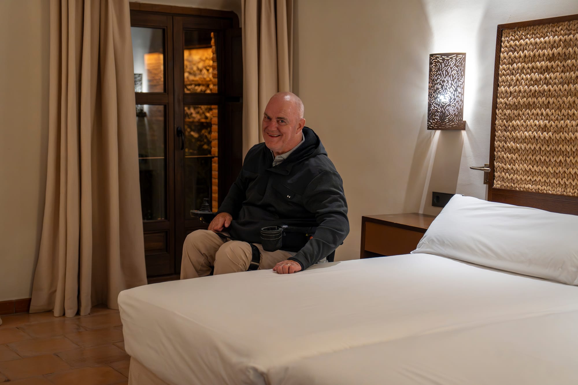 Wheelchair user in an accessible hotel room