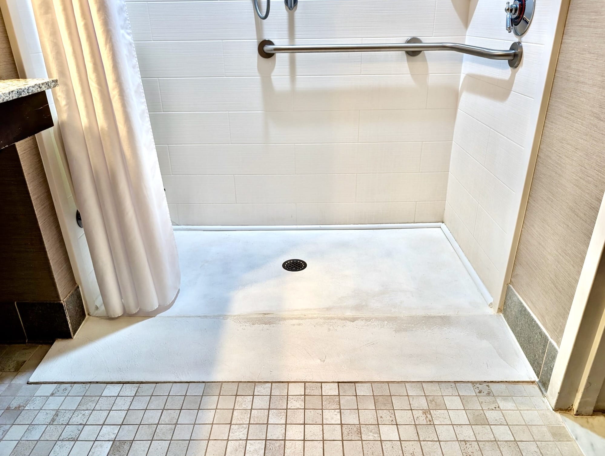 Roll-in shower and grab bars at Fairfield Inn & Suites Utica