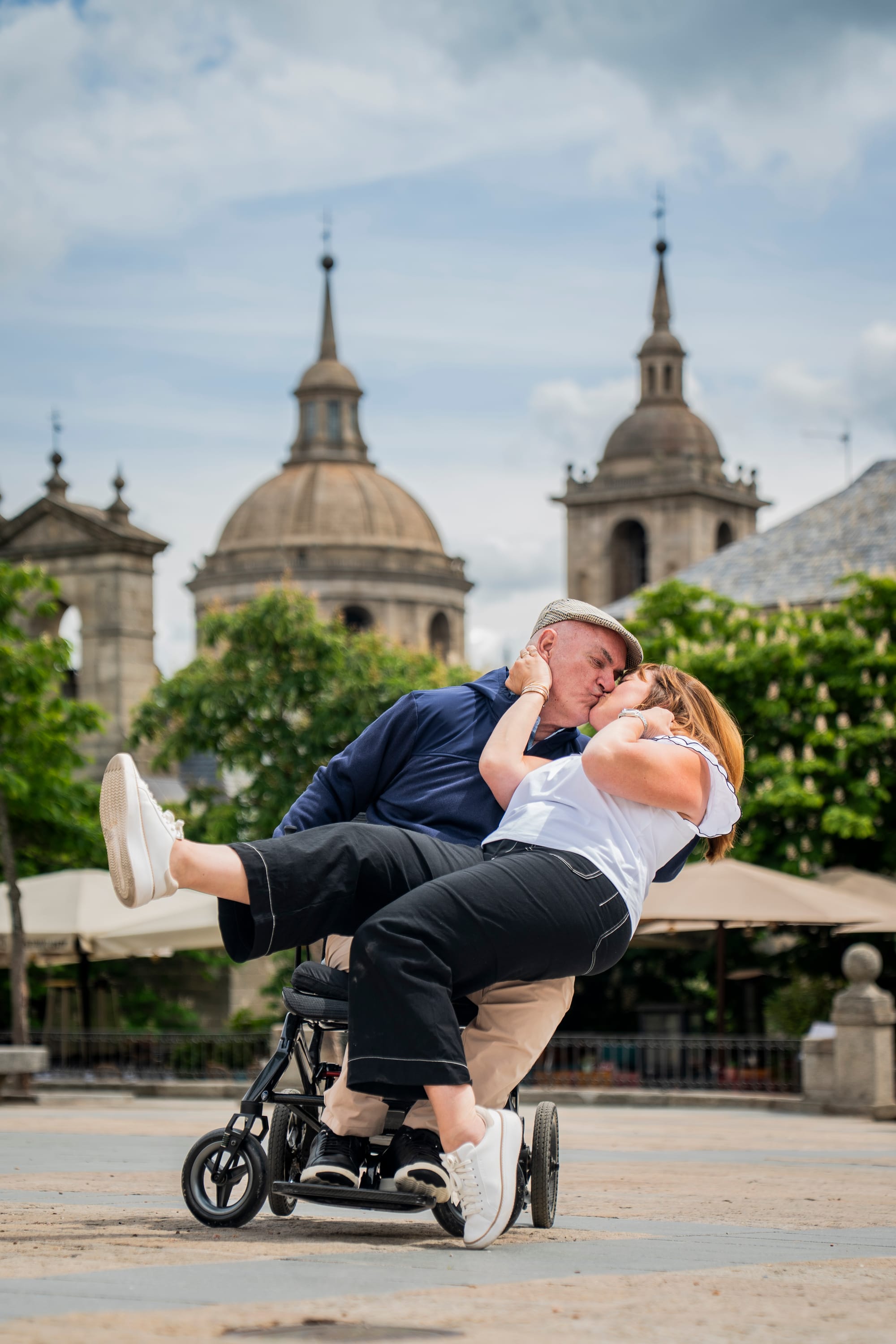 Bert, a wheelchair user, kissing his wife Joy in Madrid