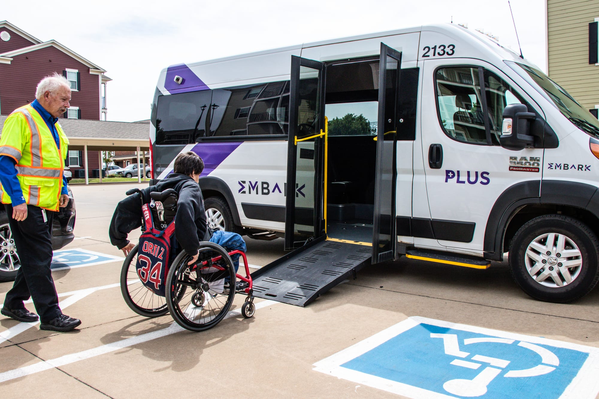 Wheelchair user entering wheelchair ramp on EMBARK transport in Oklahoma City