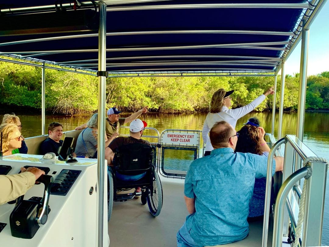 Wheelchair user and others on a cruise in Martin County, Treasure Coast River Cruises
