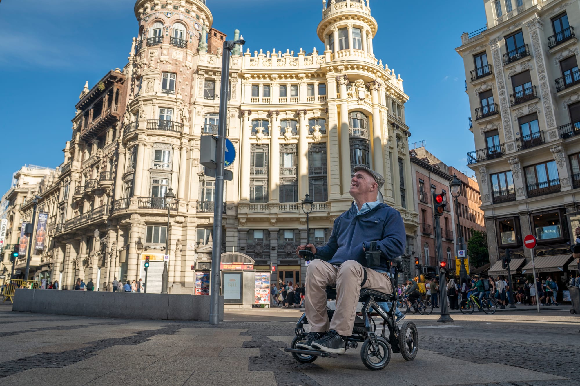Wheelchair user posing and looking up in Madrid