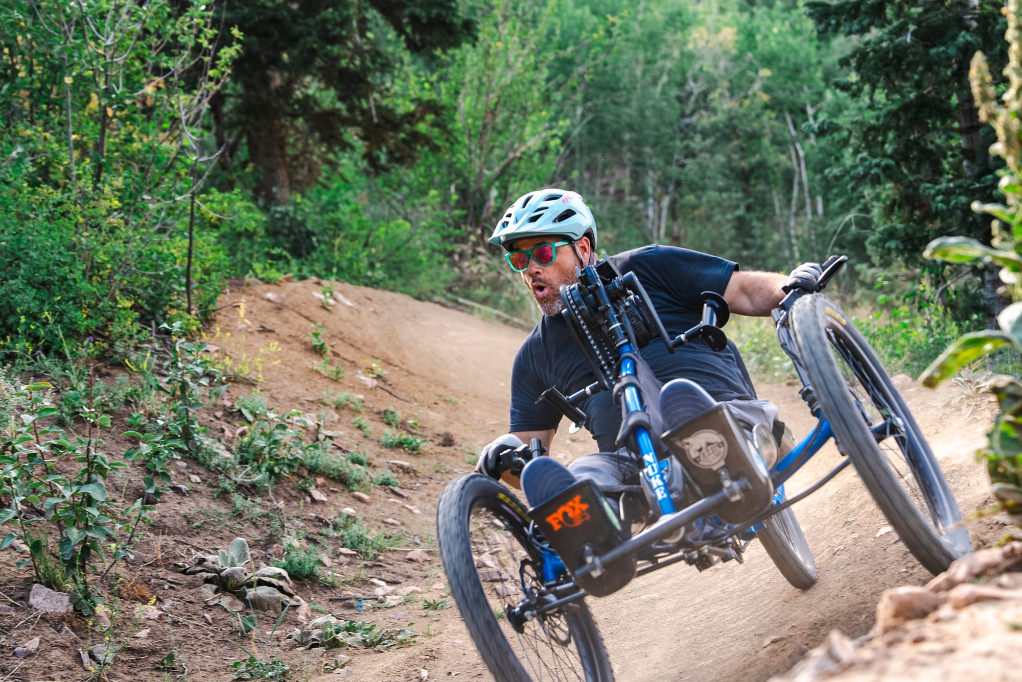 Man adaptive mountain biking downhill