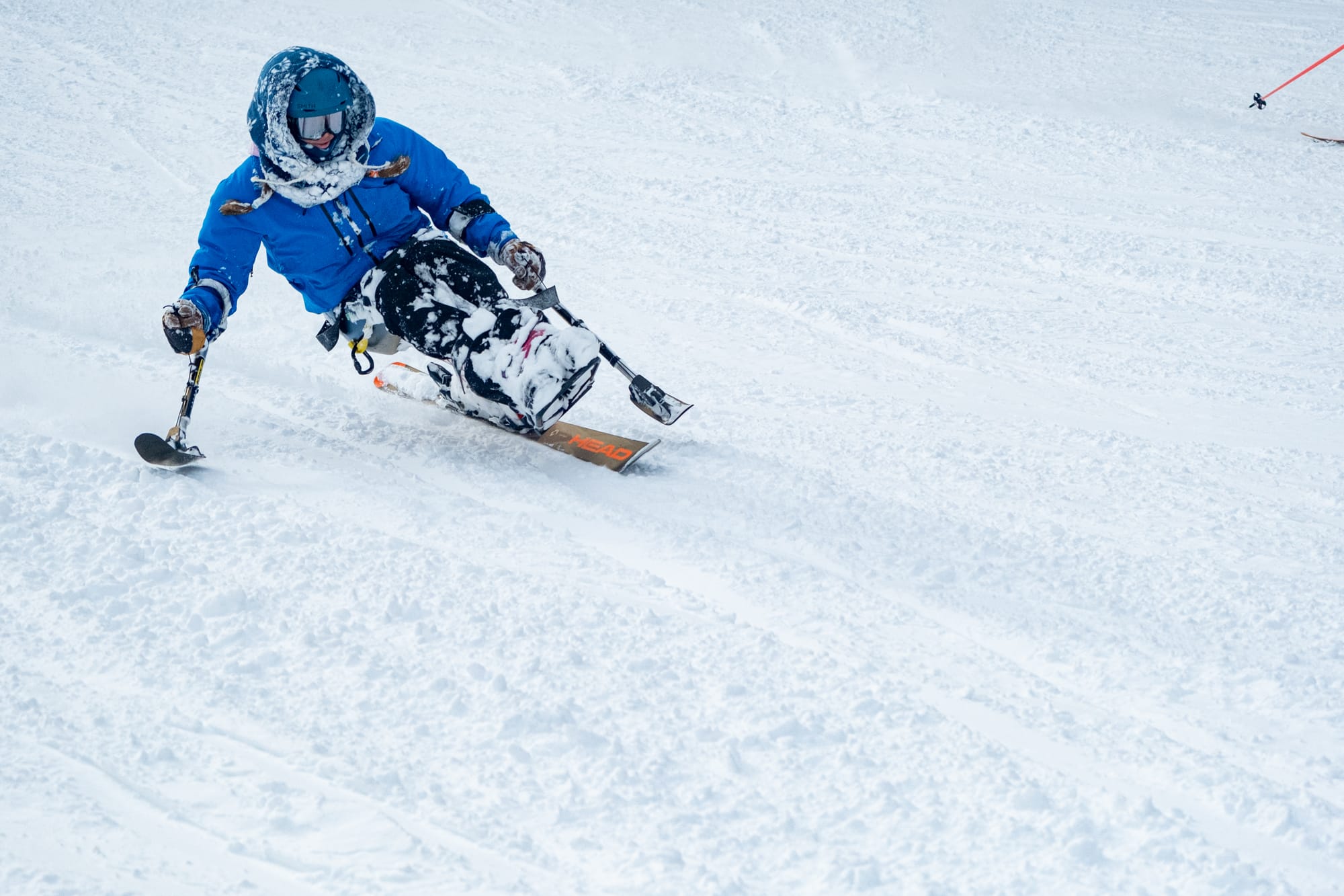 Man sit-skiing down the slopes in Park City