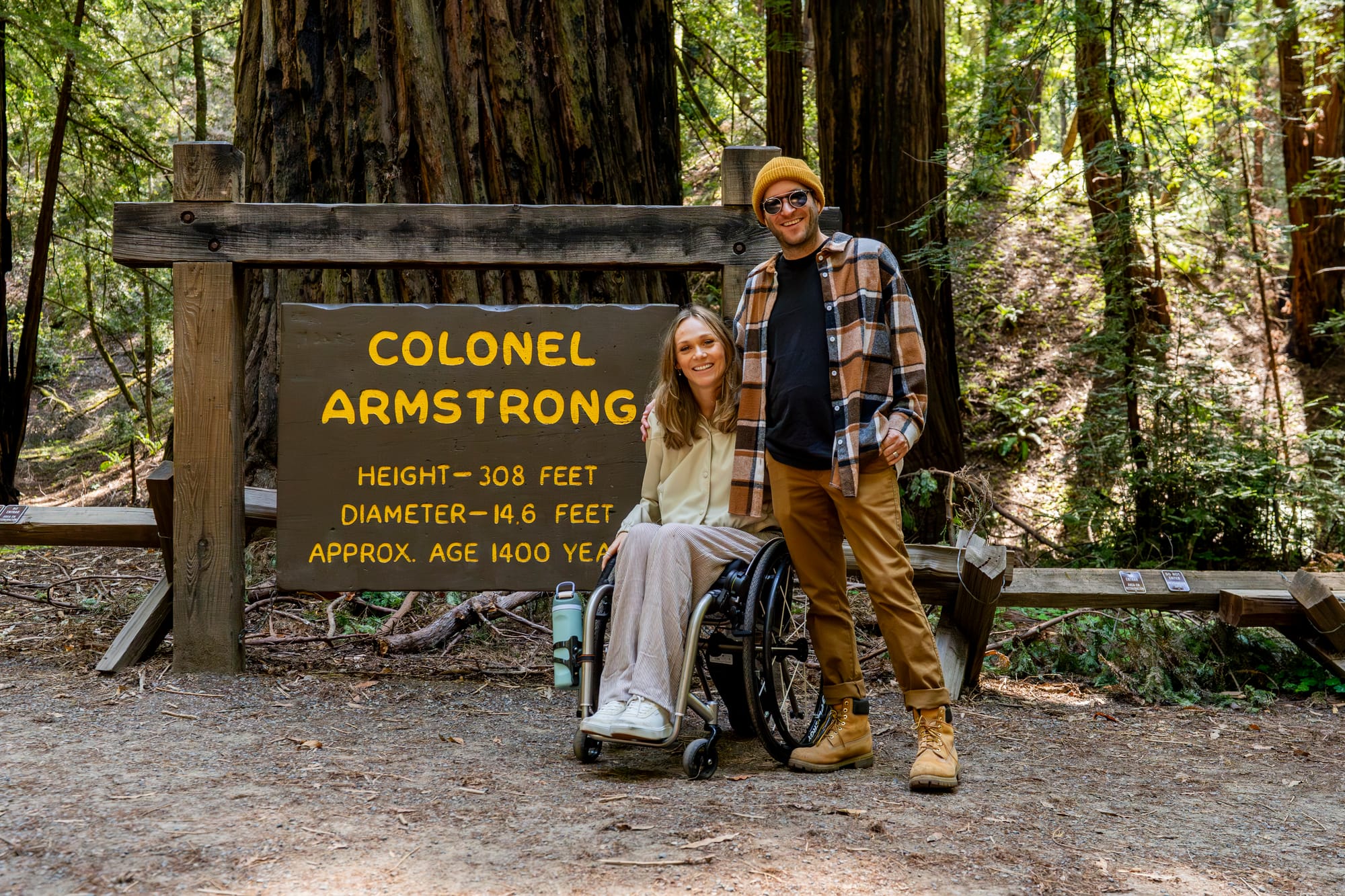 Wheelchair user and husband at Armstrong Redwoods State Natural Reserve