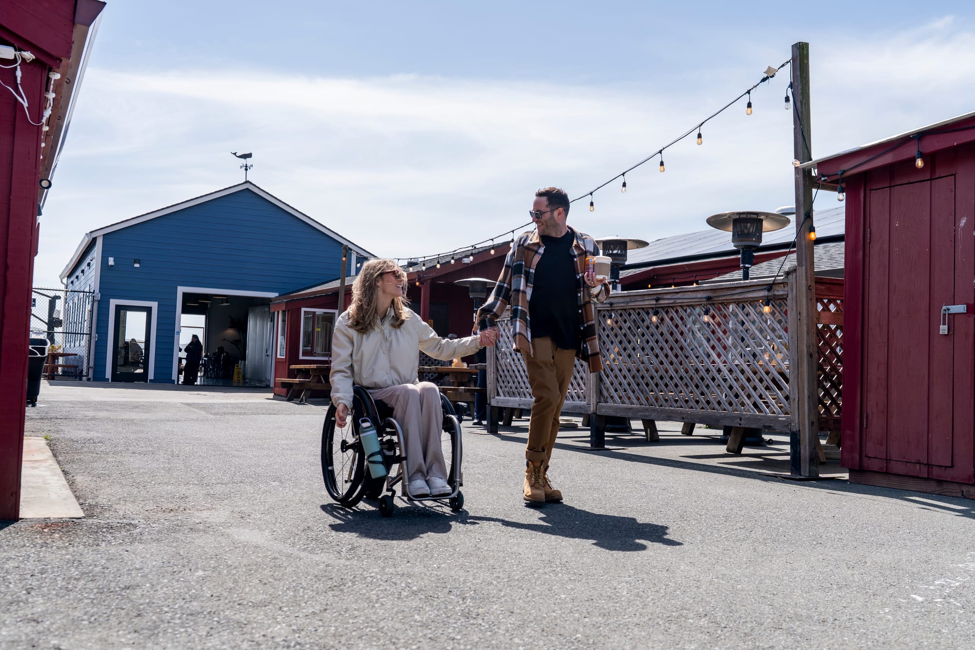 Wheelchair user and her boyfriend holding hands in Sonoma County