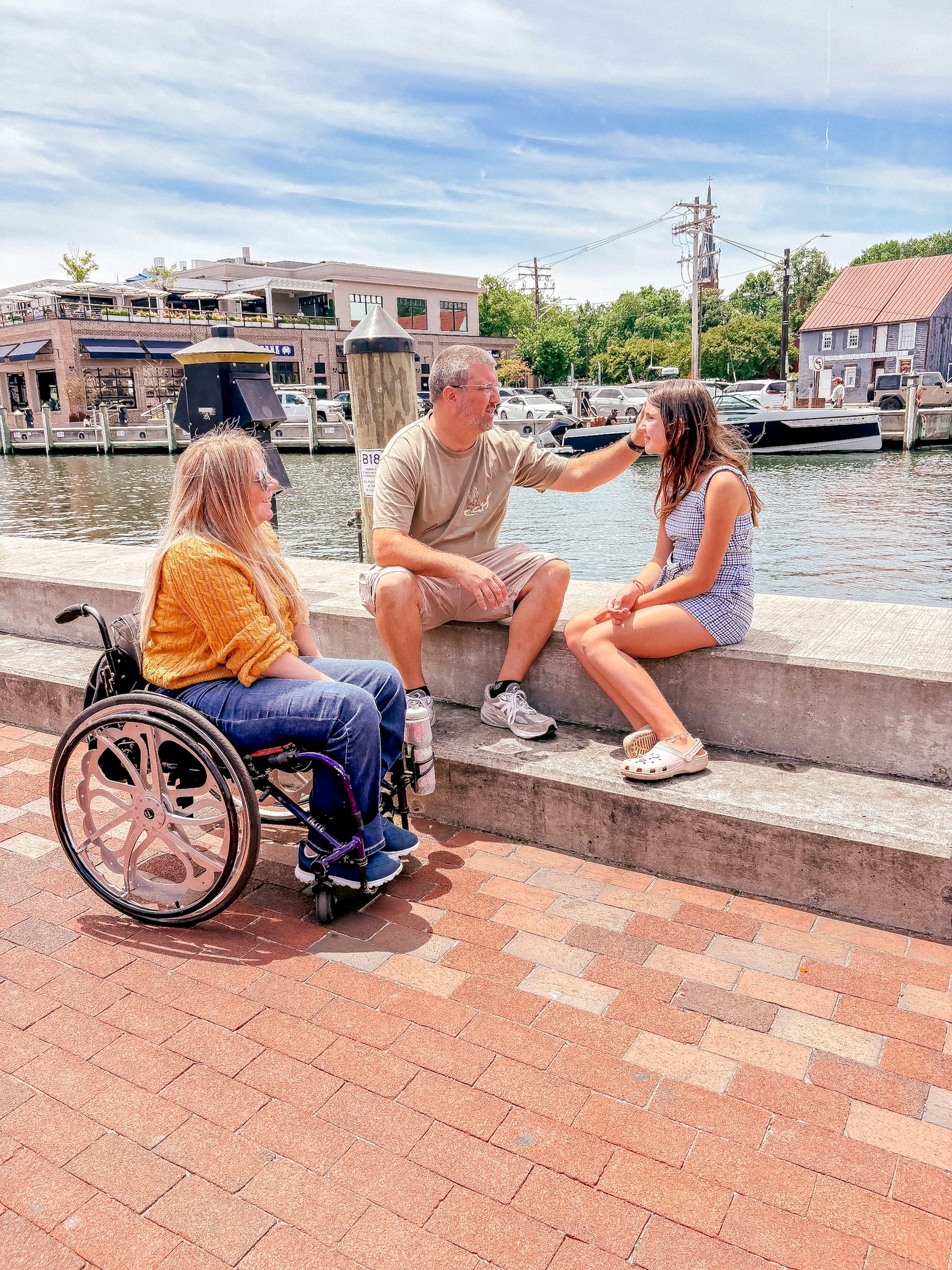 Wheelchair user, husband, and daughter on the waterfront in Annapolis