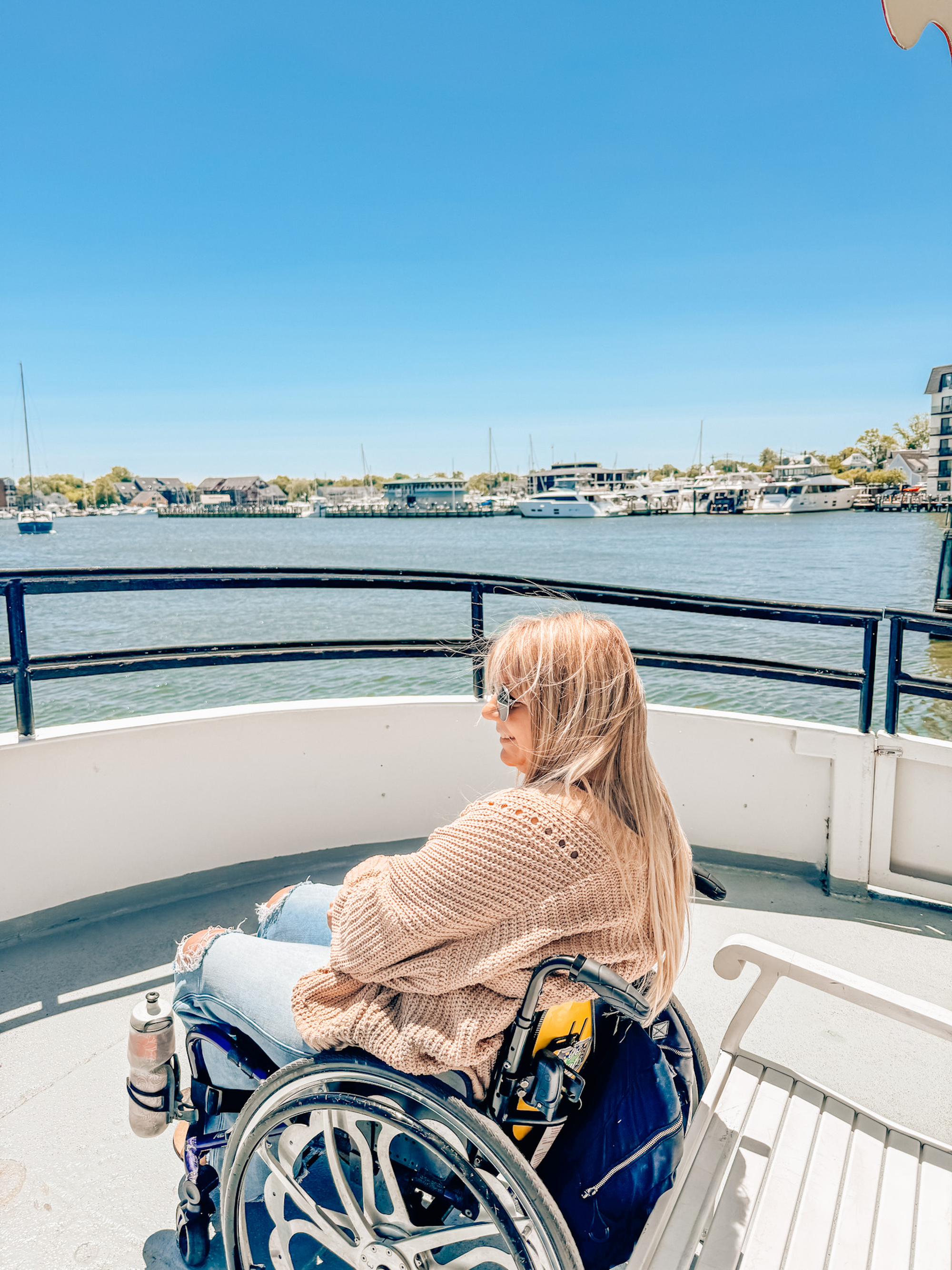 Wheelchair user on a boat looking out at the ocean