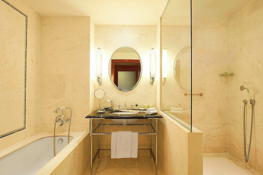 Bathtub on the left, roll-in shower on the right, sink in the middle at The Westin Valencia