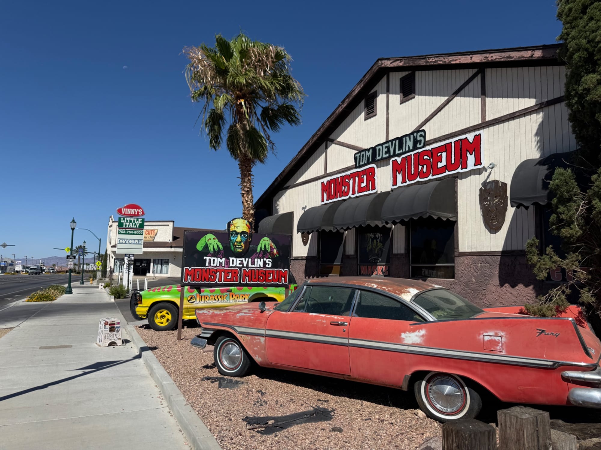 Older cars outside of Tom Devlin's Monster Museum