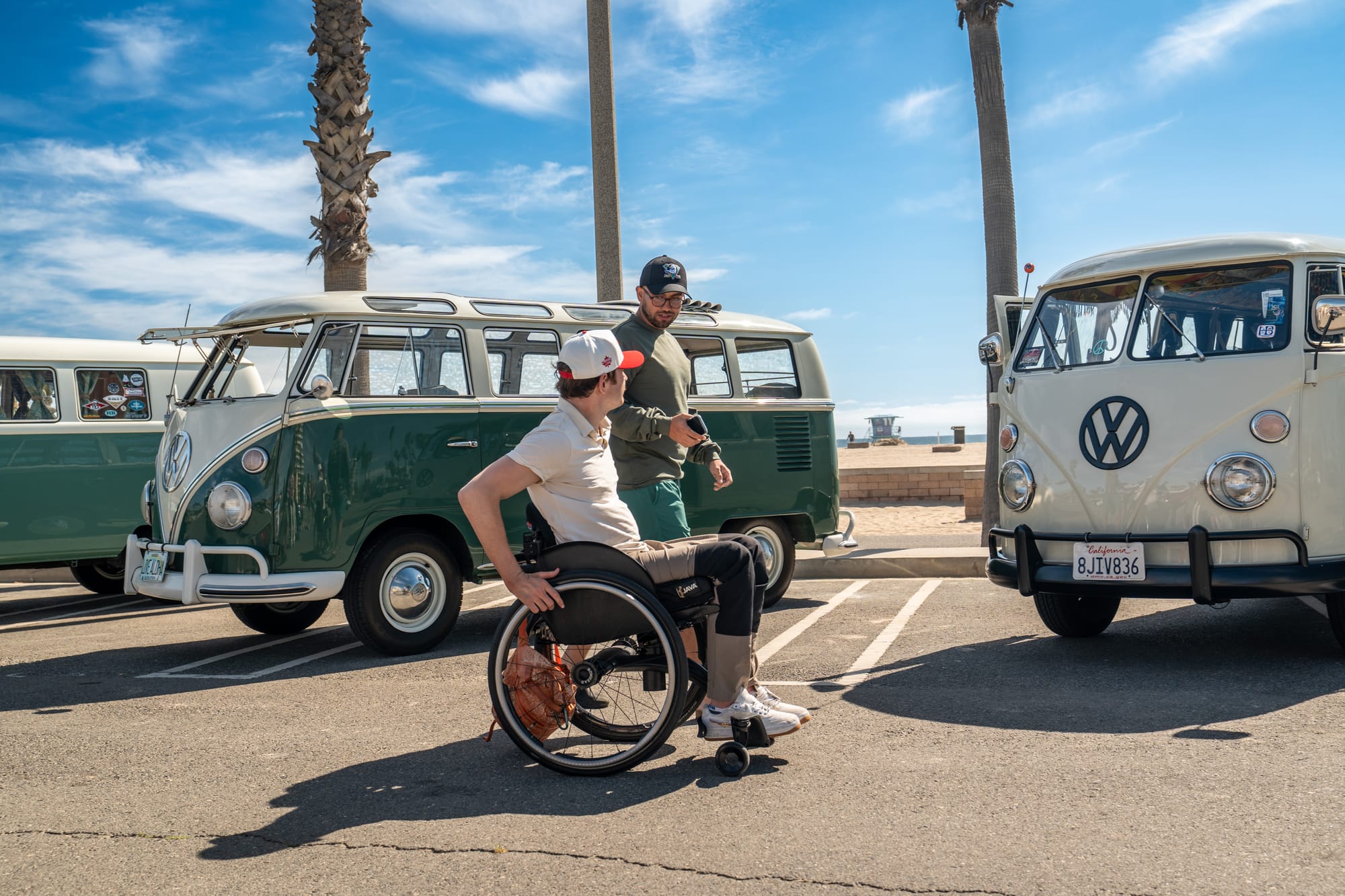 Wheelchair user and friend at Huntington State Beach