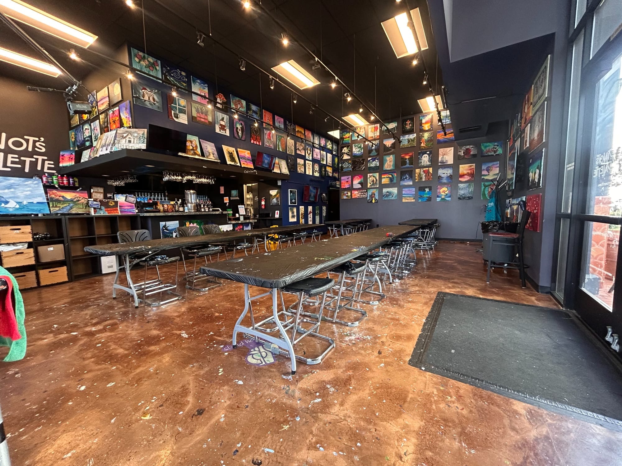 Interior of Pinot's Palette, with tables and artwork