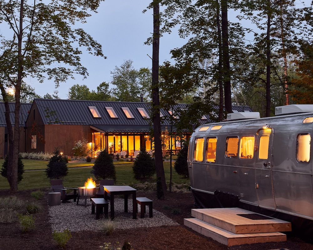 Airstream, fire pit, and table at AutoCamp Catskills