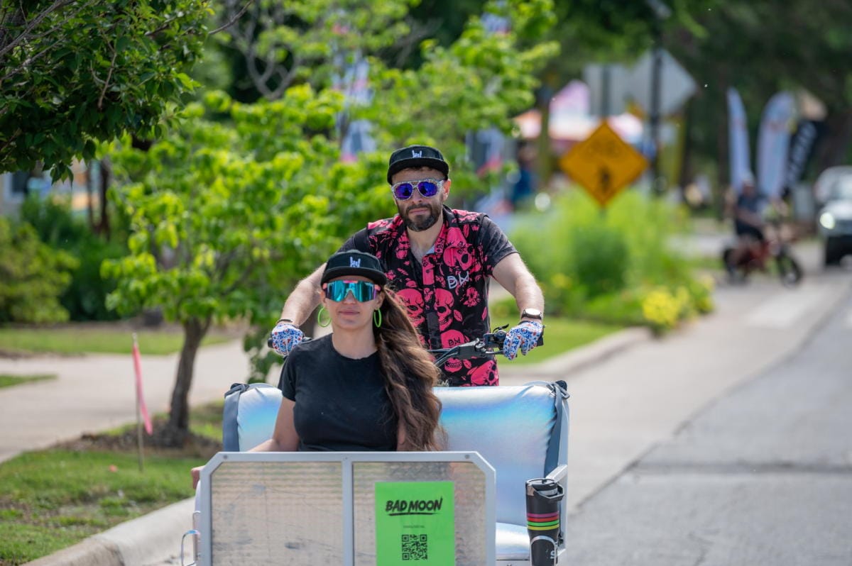 Two people enjoying a guided bike tour with Ride Bad Moon